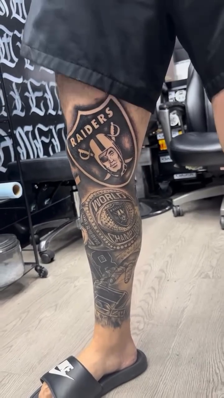 Raiders leg sleeve tattoo realism tattoo on the calf by Brian Cruz Garcia