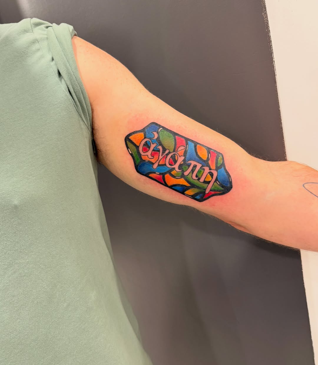 Colorful abstract design tattoo on the forearm by Lexi Odam