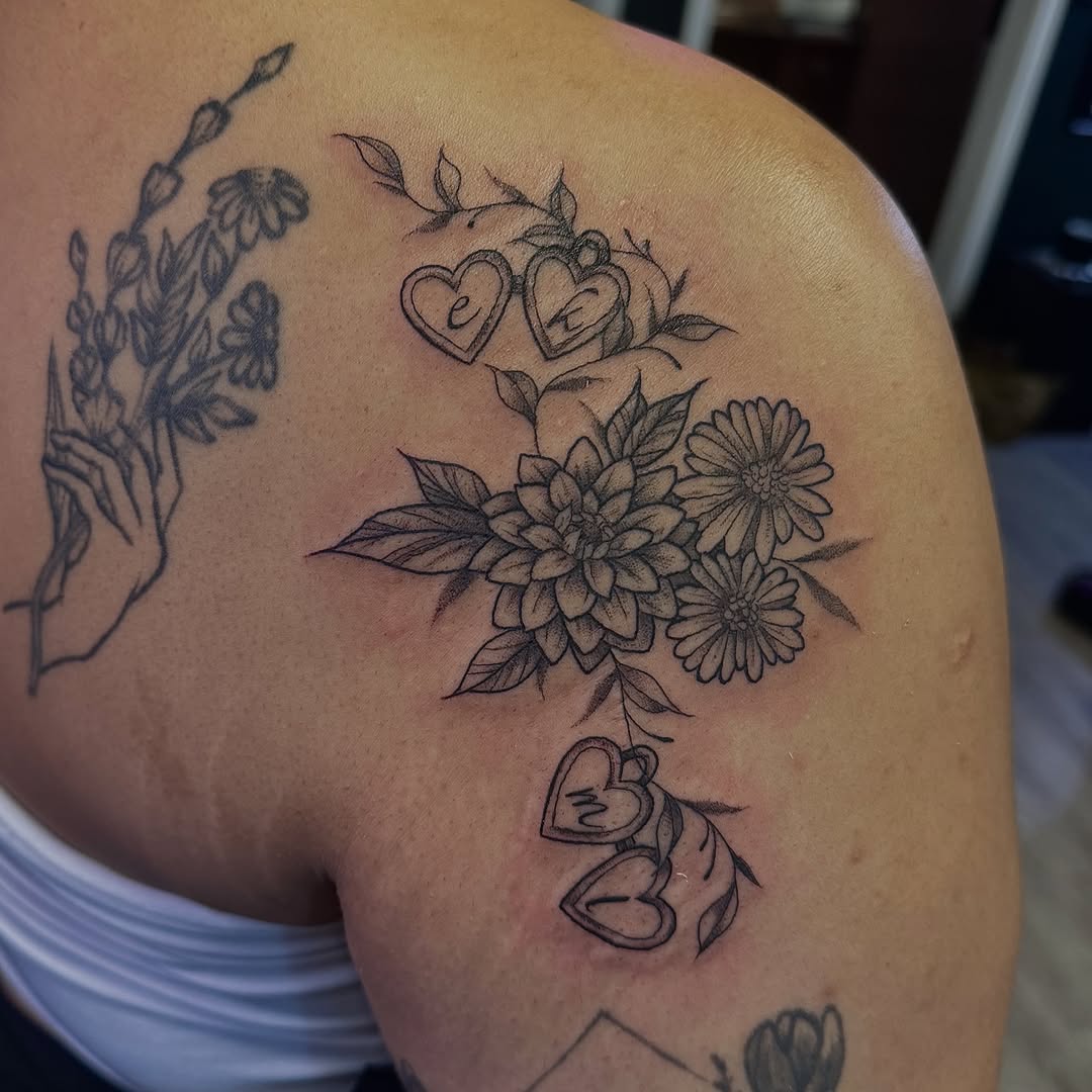 Flower bouquet black and grey tattoo on the shoulder by Kat Bennett