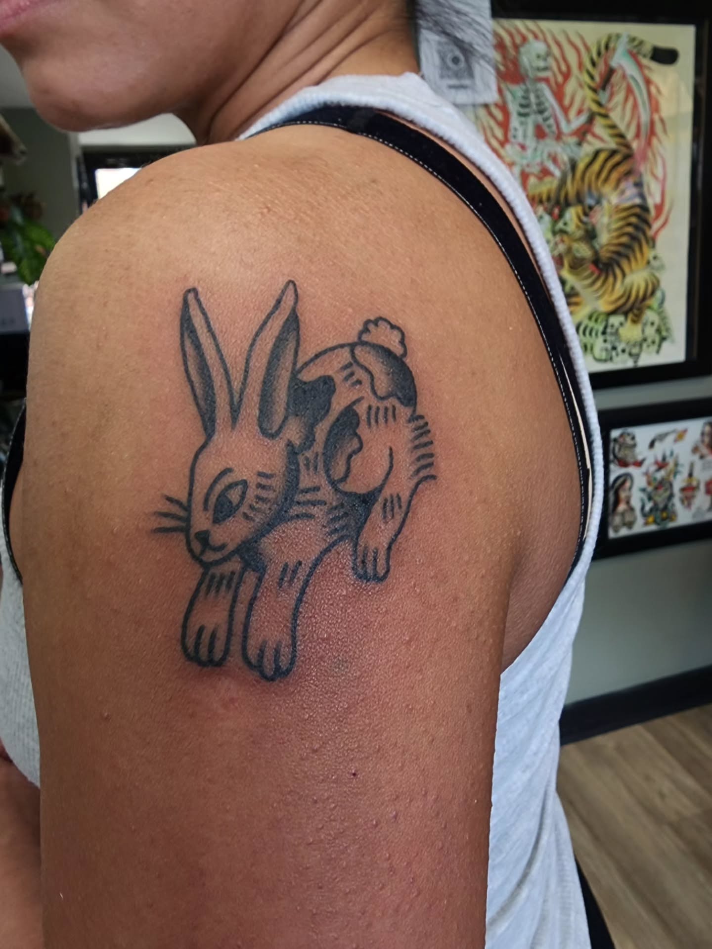 Rabbit black and grey tattoo on the shoulder by πππππ