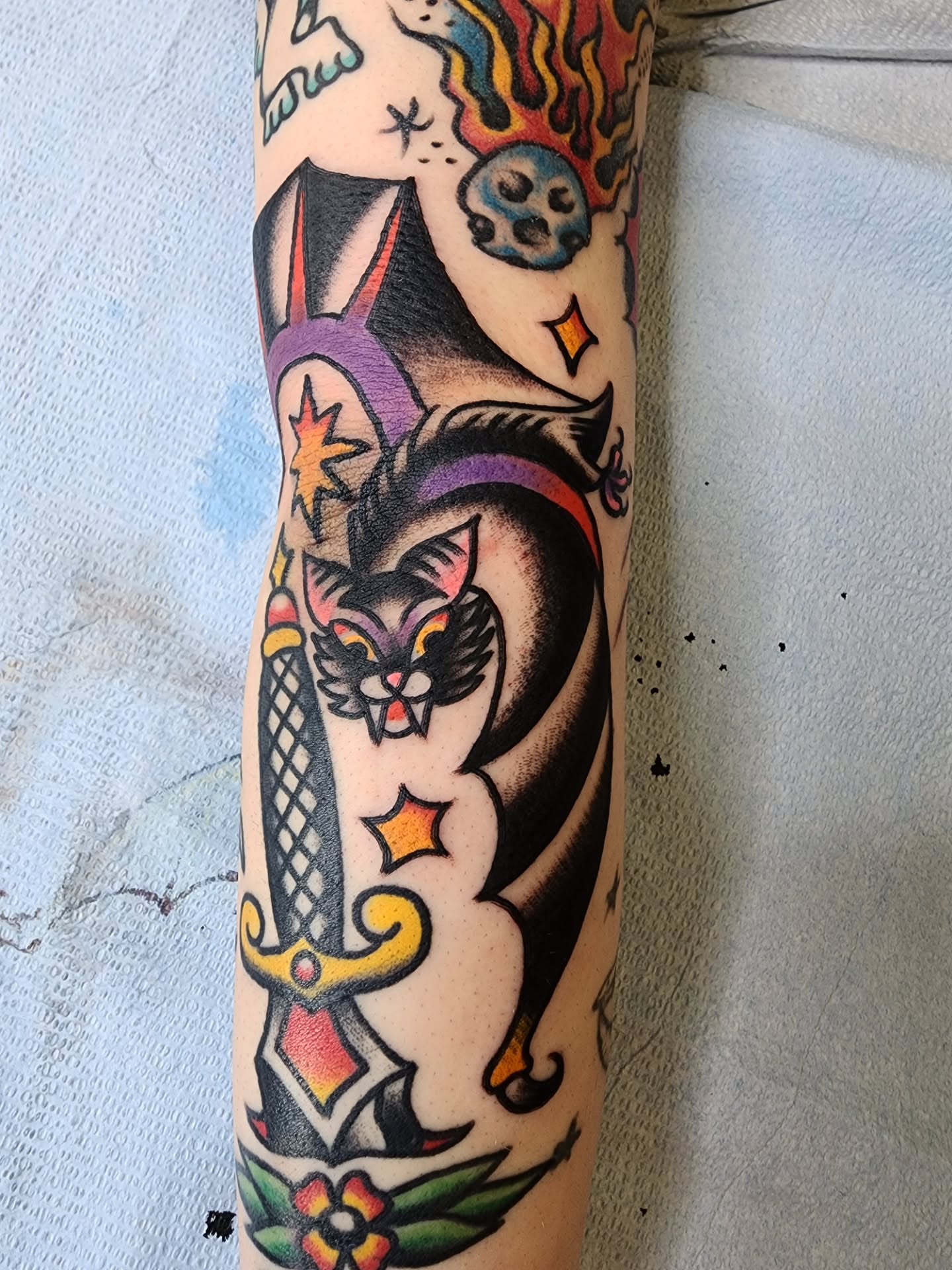 Cat and dagger American traditional tattoo on the forearm by πππππ