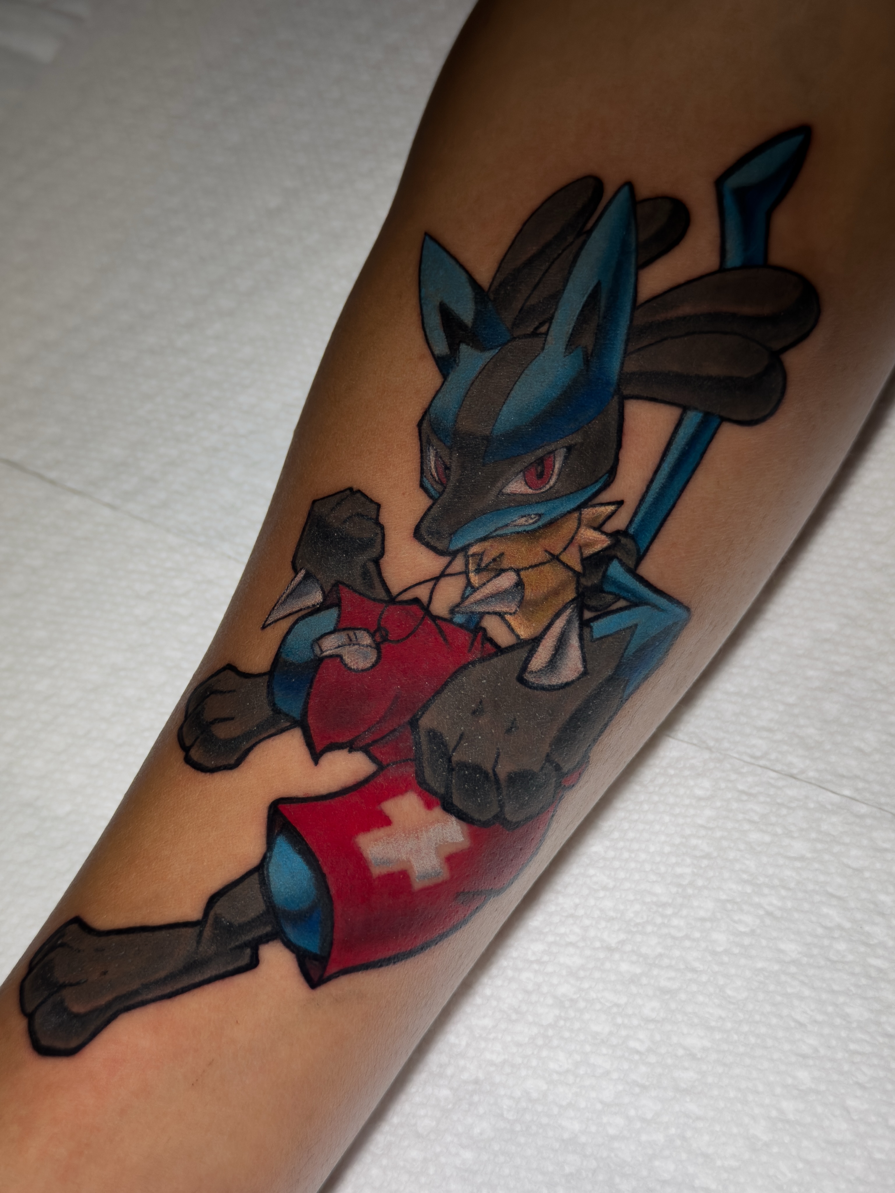 Fox character anime tattoo on the forearm by Tracci King