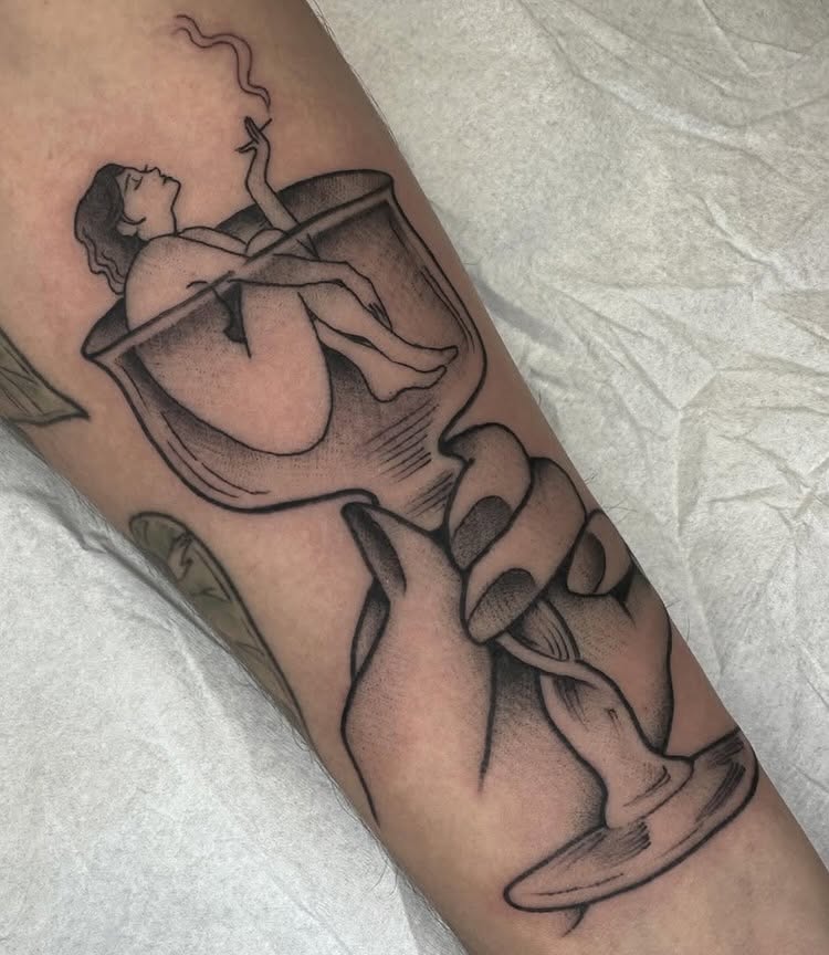 Woman smoking black and grey tattoo on the forearm by Amelia Rose, Los Angeles, California