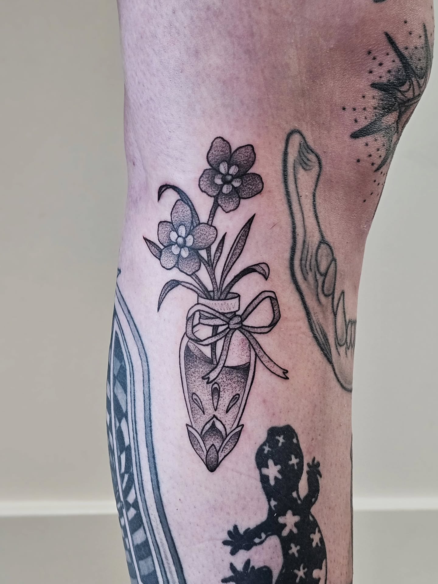 Flower bouquet dotwork tattoo on the forearm by Kylie Lund