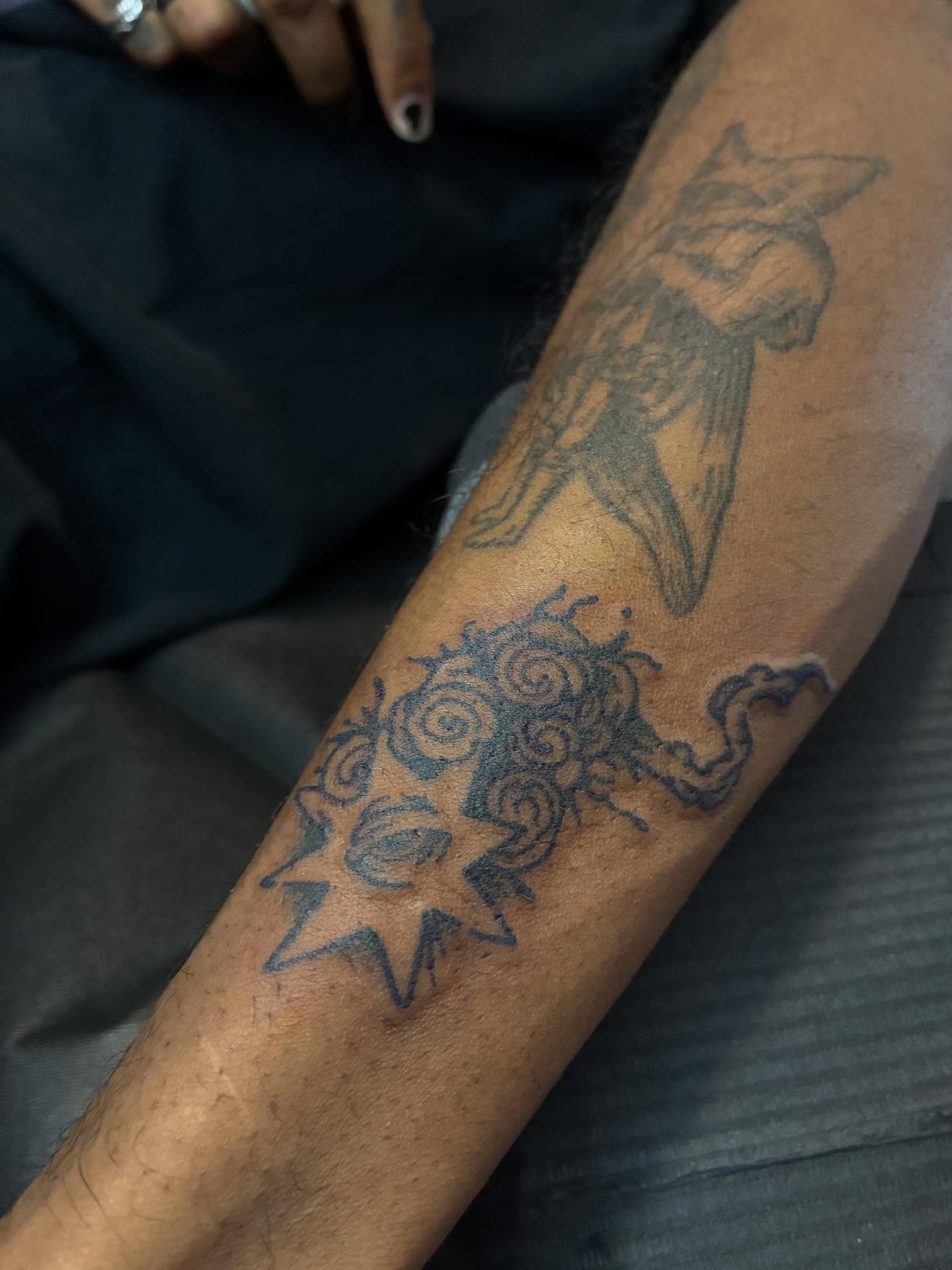 Astronaut and sun black and grey tattoo on the forearm by Zachary R Bobkoff