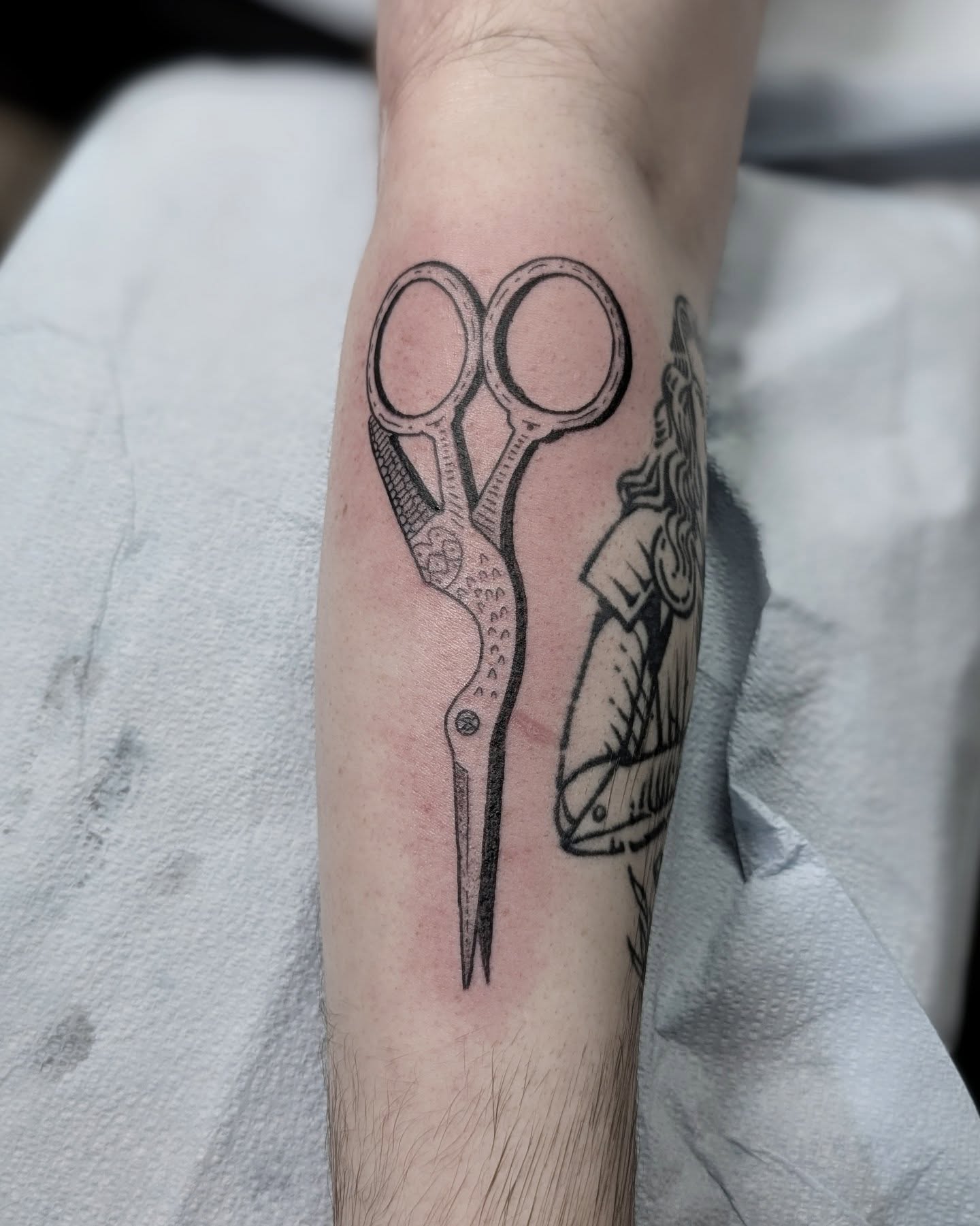 Scissors black and grey tattoo on the forearm by Dani Harkey