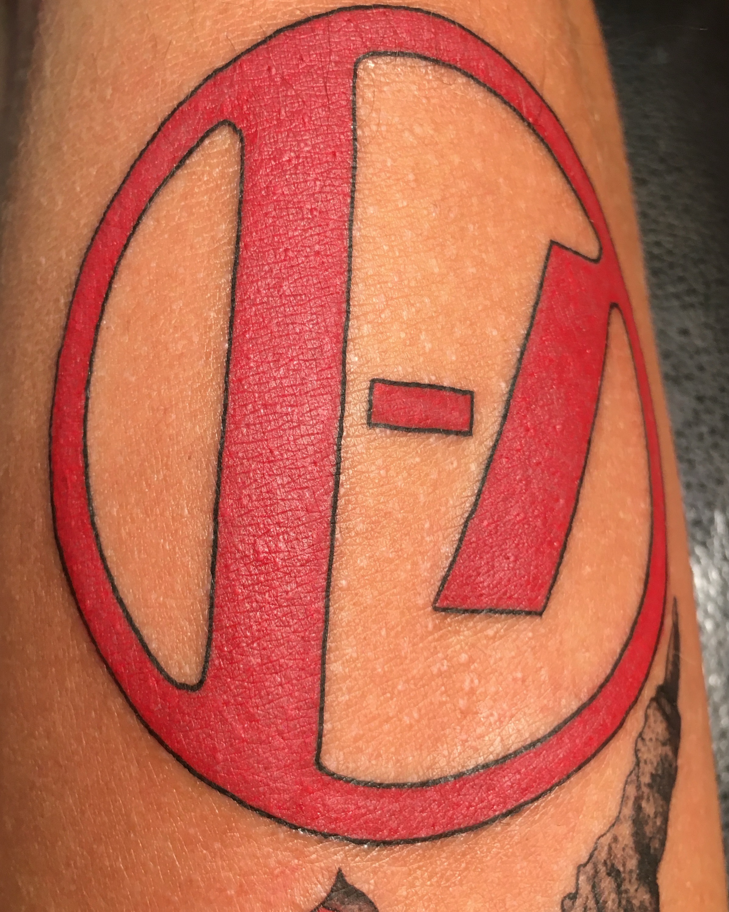 Letter 'E' dotwork tattoo on the forearm by Nahomi Luna - Memphis & Cordova Tattoo, Memphis, Tennessee