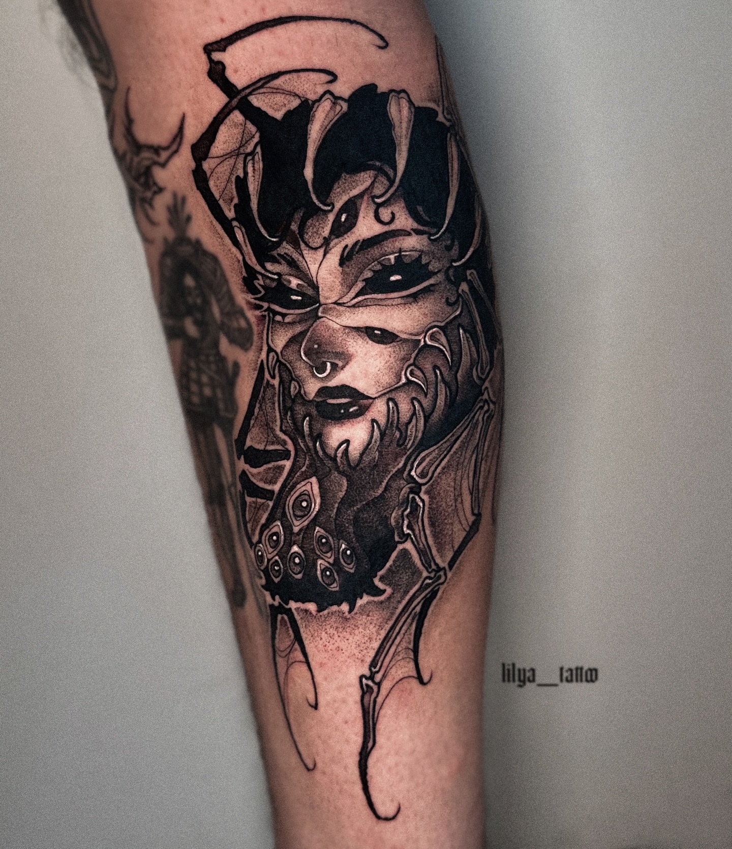 Tattoo by @lilya_tattoo — dark_realism, black_and_grey