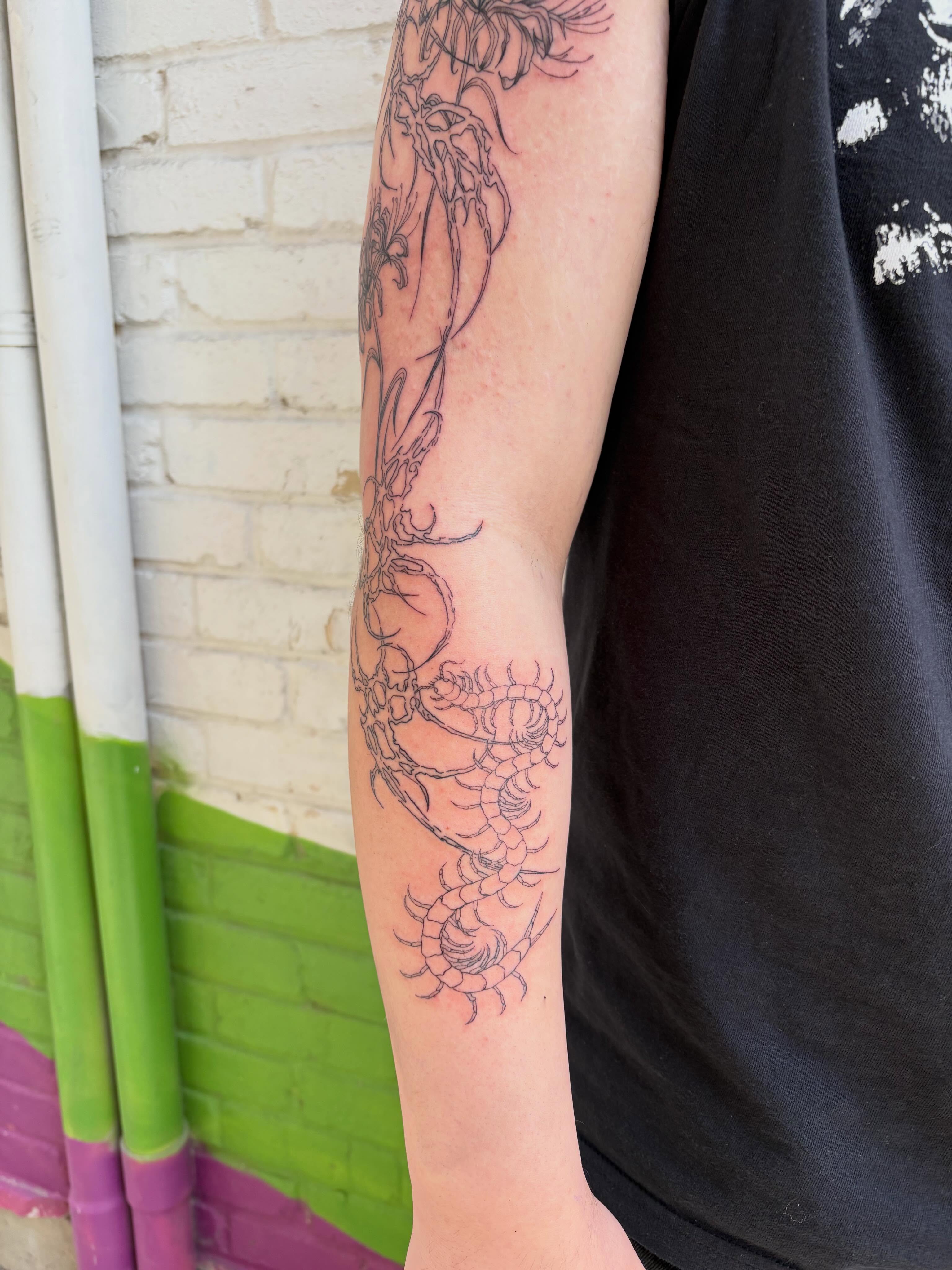 Dragon black and grey tattoo on the forearm by Levi Morales