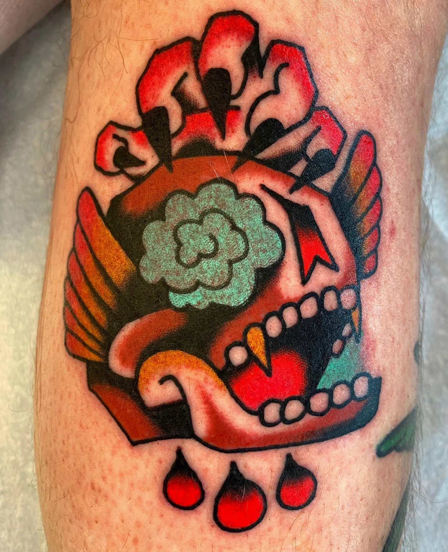 Skull with flower American traditional tattoo on the forearm by Quinn, Kansas City, Missouri
