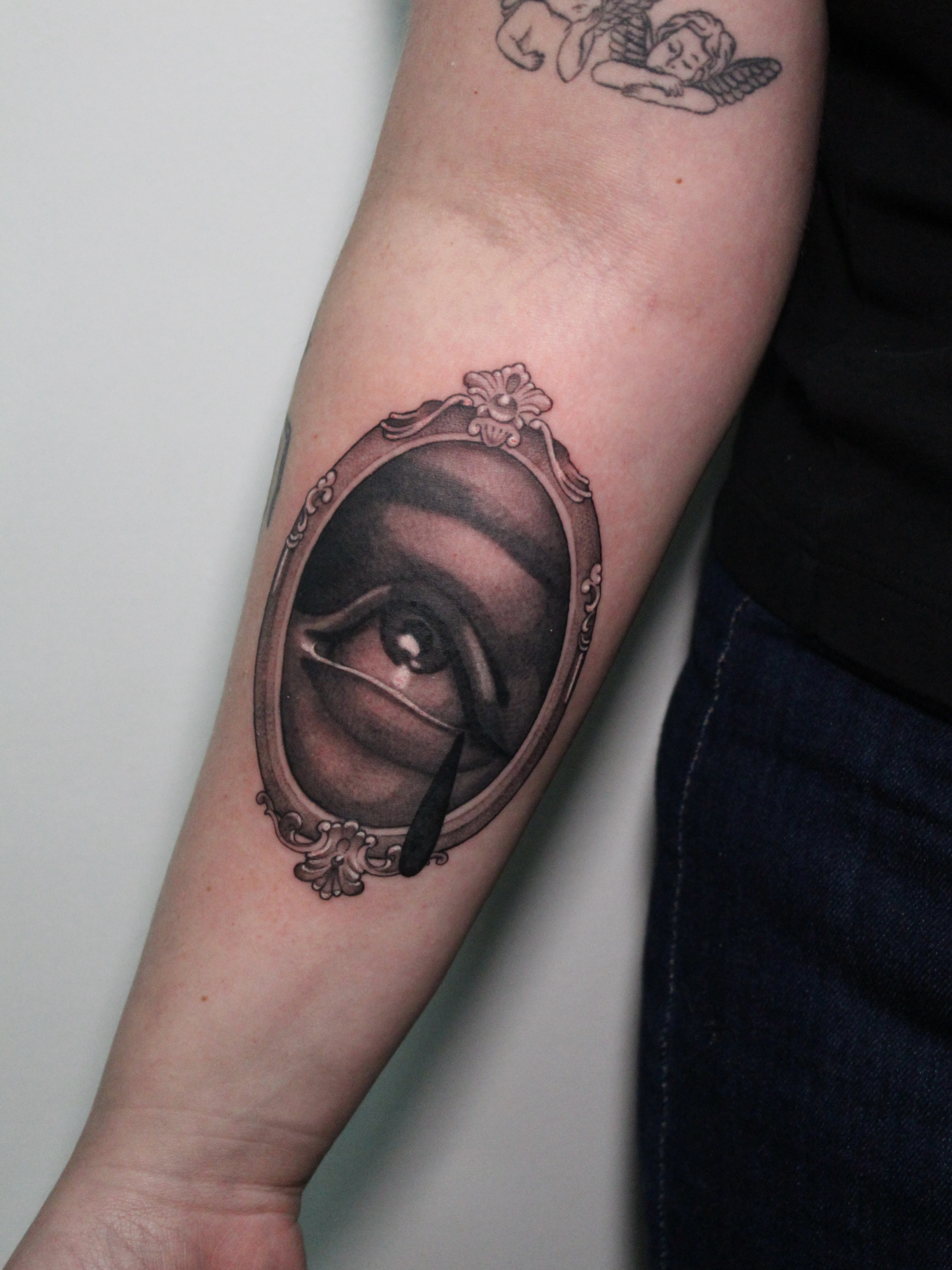 Eye in mirror realism tattoo on the forearm by 𝘋𝘪𝘢𝘯𝘯𝘢
