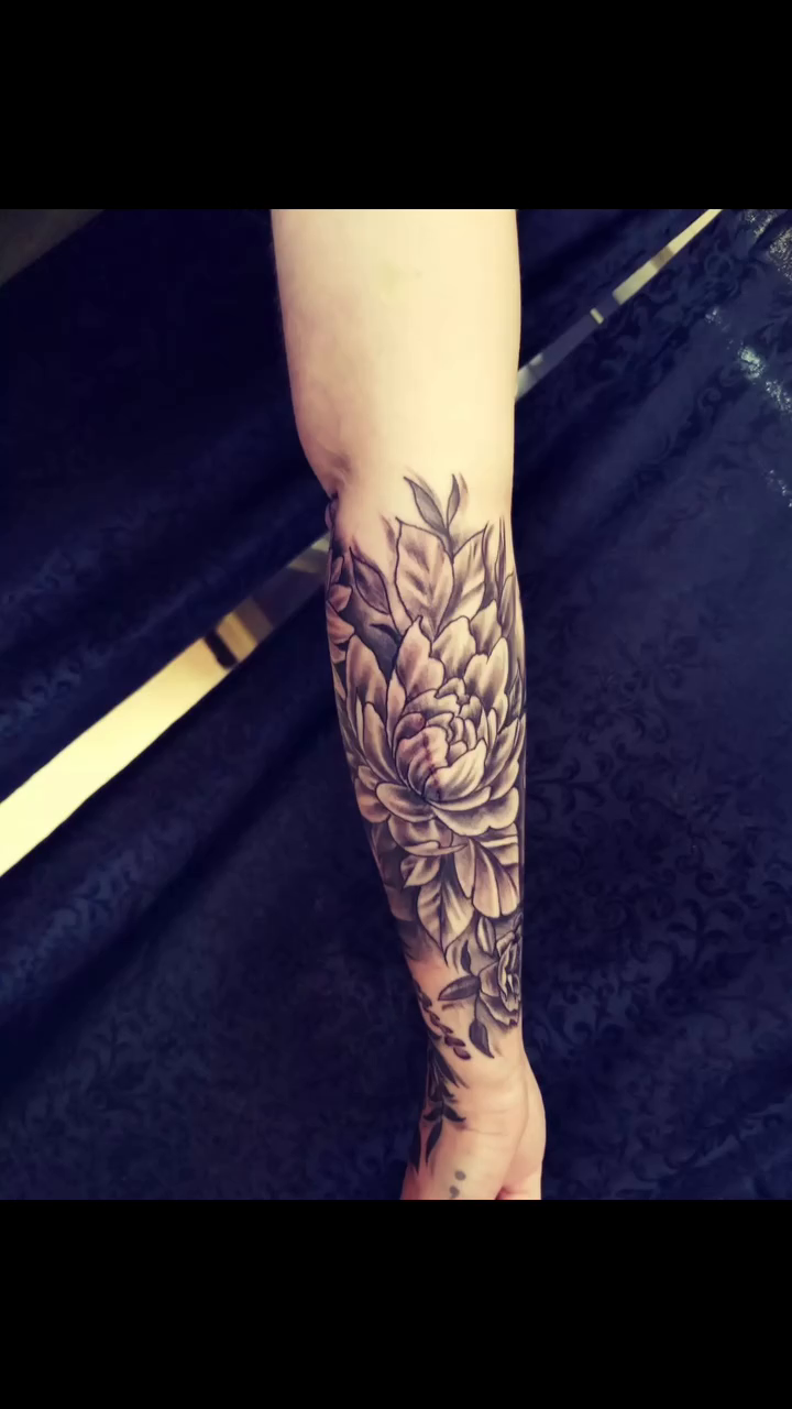 Floral sleeve with geometric elements fine line tattoo on the forearm by Dennis Foust