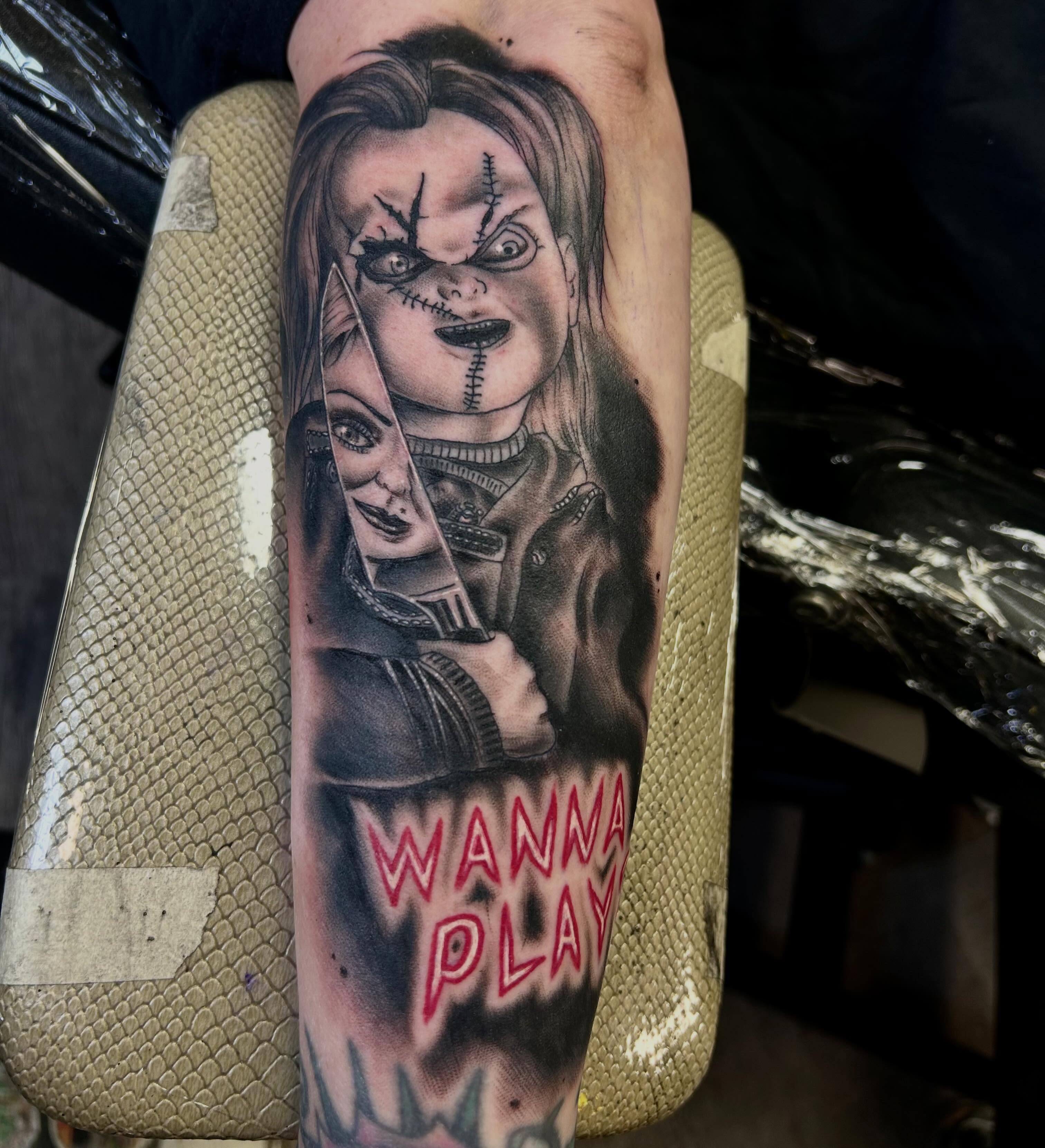 Chucky realism tattoo on the forearm by darklord_666