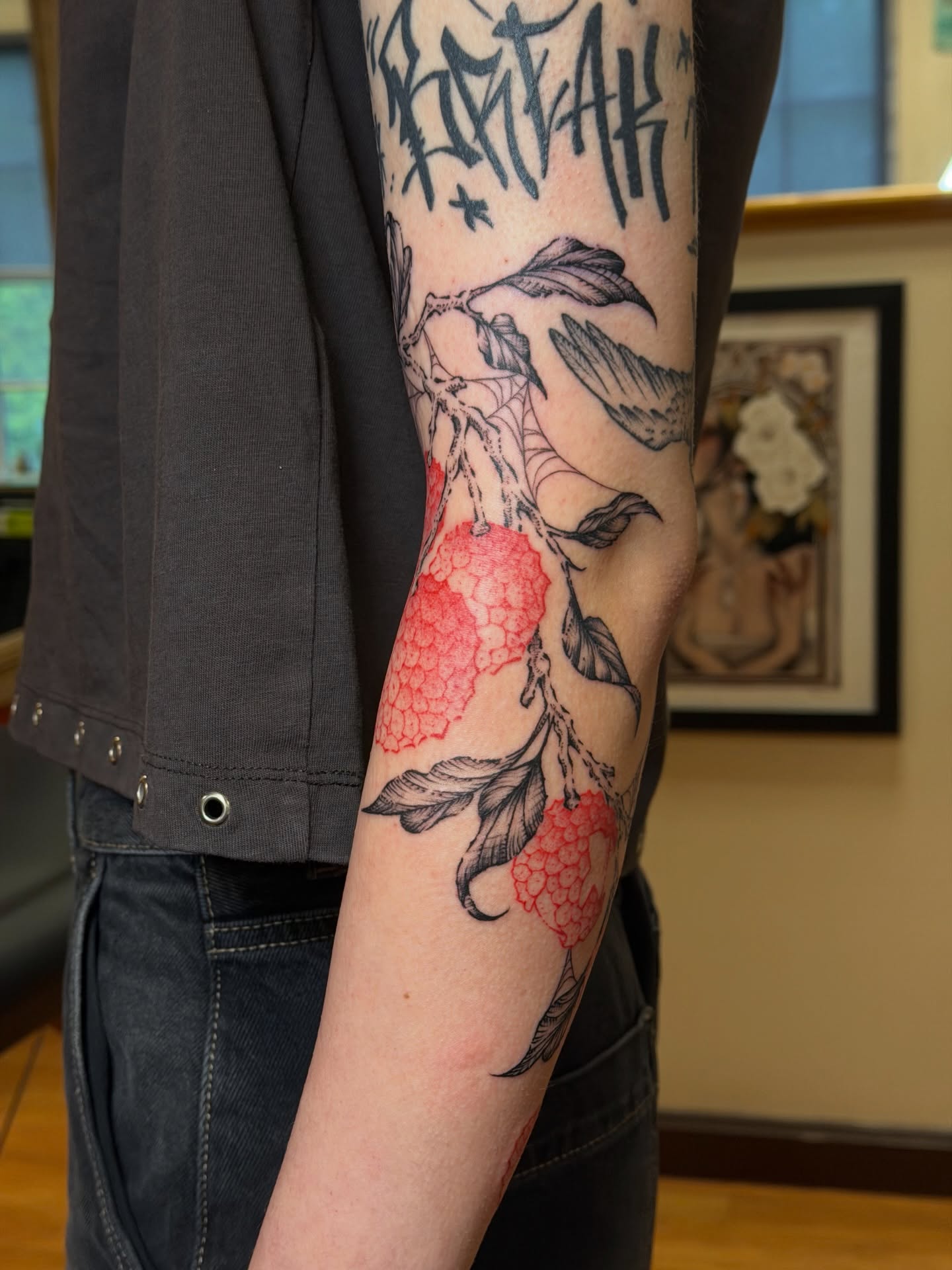 Raspberry bush realism tattoo on the forearm by Gianna Calisi
