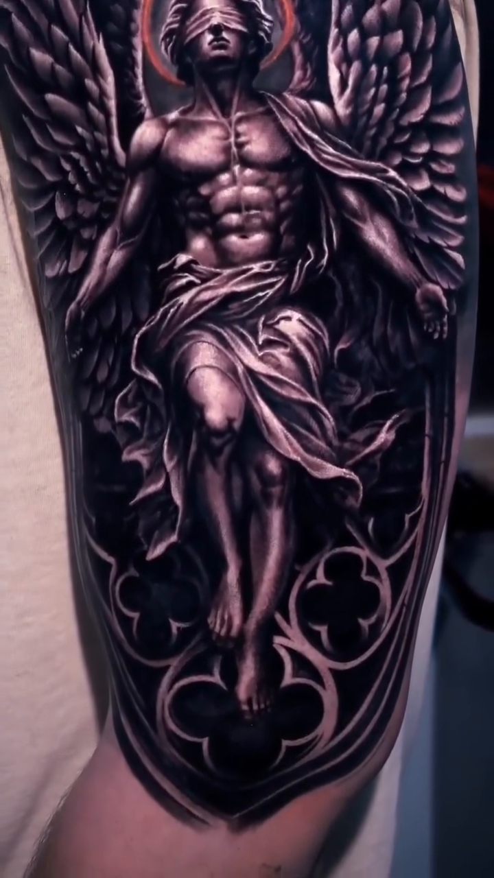 Angel with gothic architectural elements realism tattoo on the upper arm by George Lange