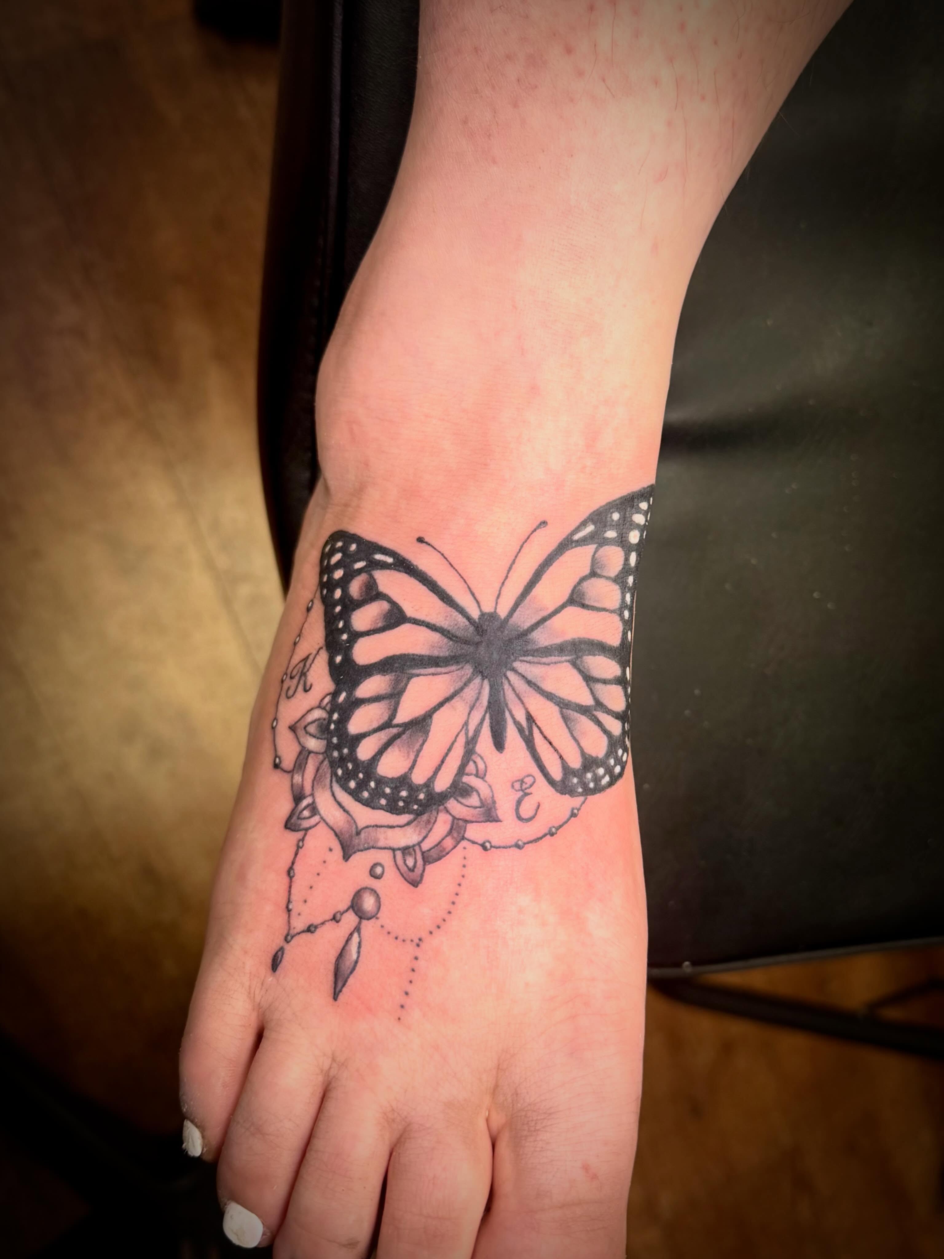Butterfly dotwork tattoo on the foot by Mikey