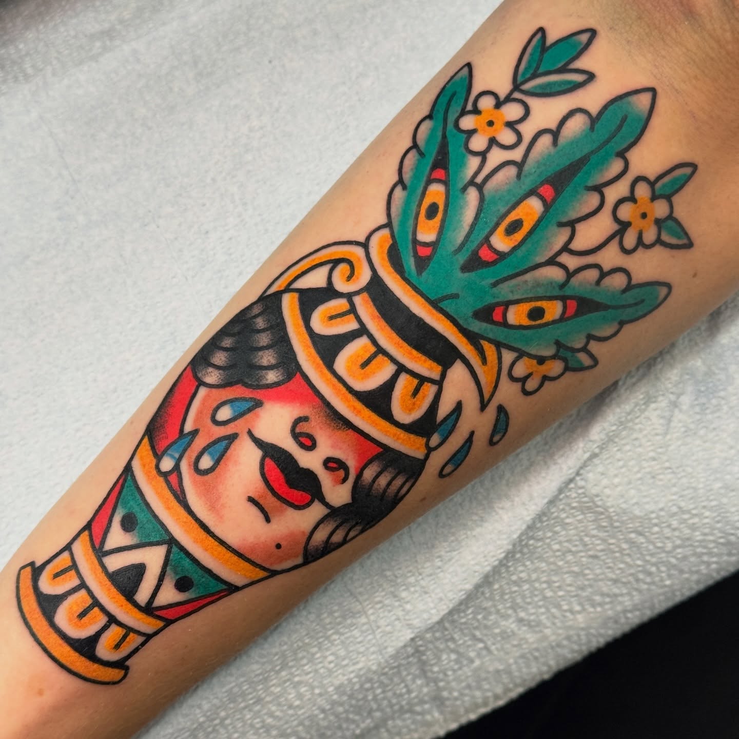Mexican deity American traditional tattoo on the forearm by Rafael Torres, San Francisco, California