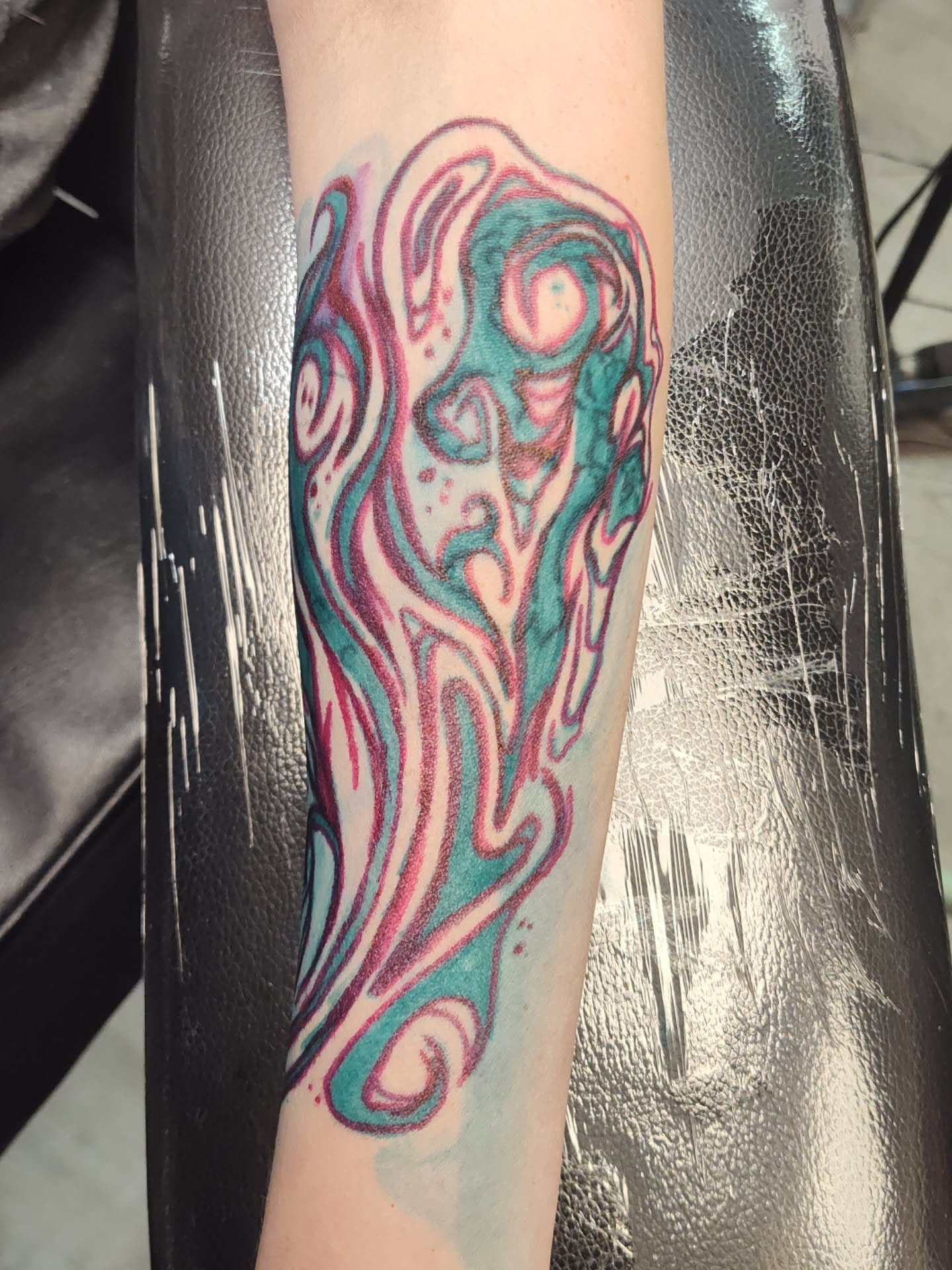 Abstract flame new school tattoo on the forearm by Mercury