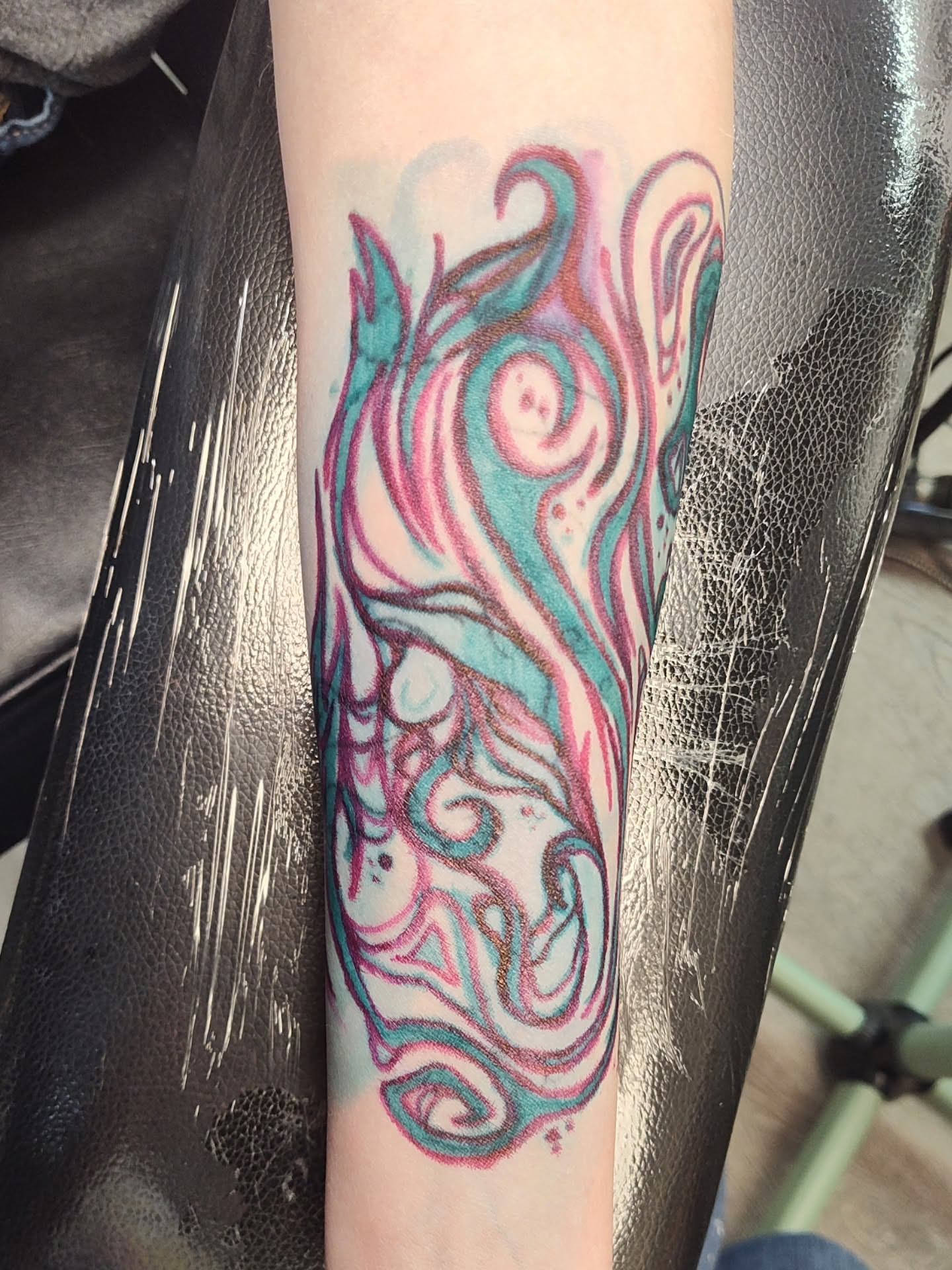 Abstract swirls new school tattoo on the forearm by Mercury