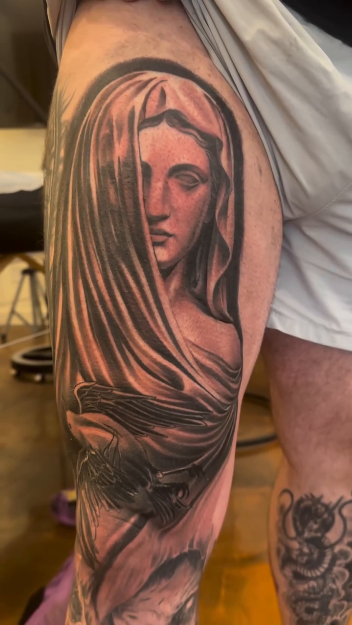 Tattoo by @arclighttattoo — dark_realism, black_and_grey