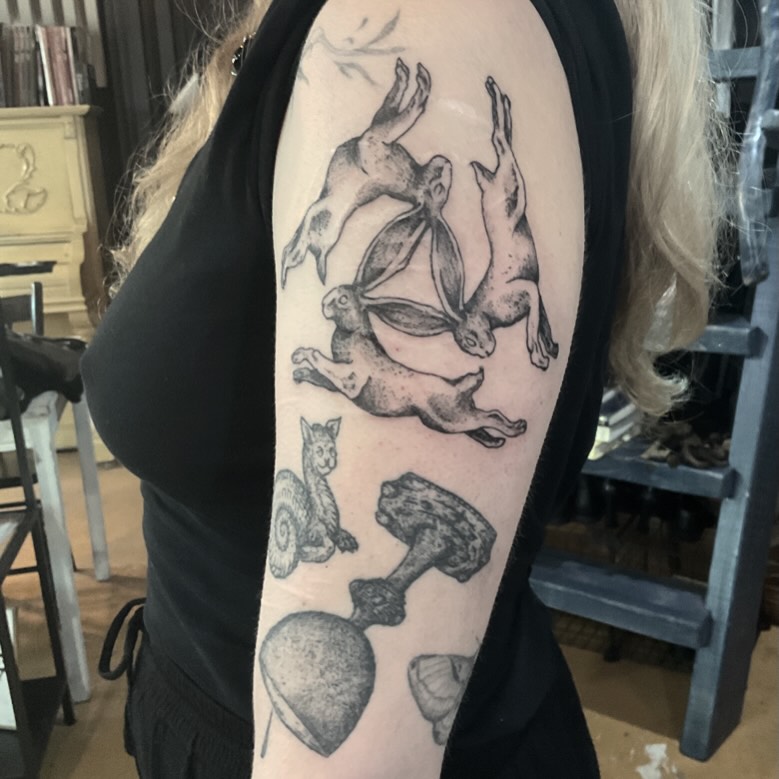 Rabbits and dumbbell black and grey tattoo on the forearm by ๐ญ๐๐๐๐