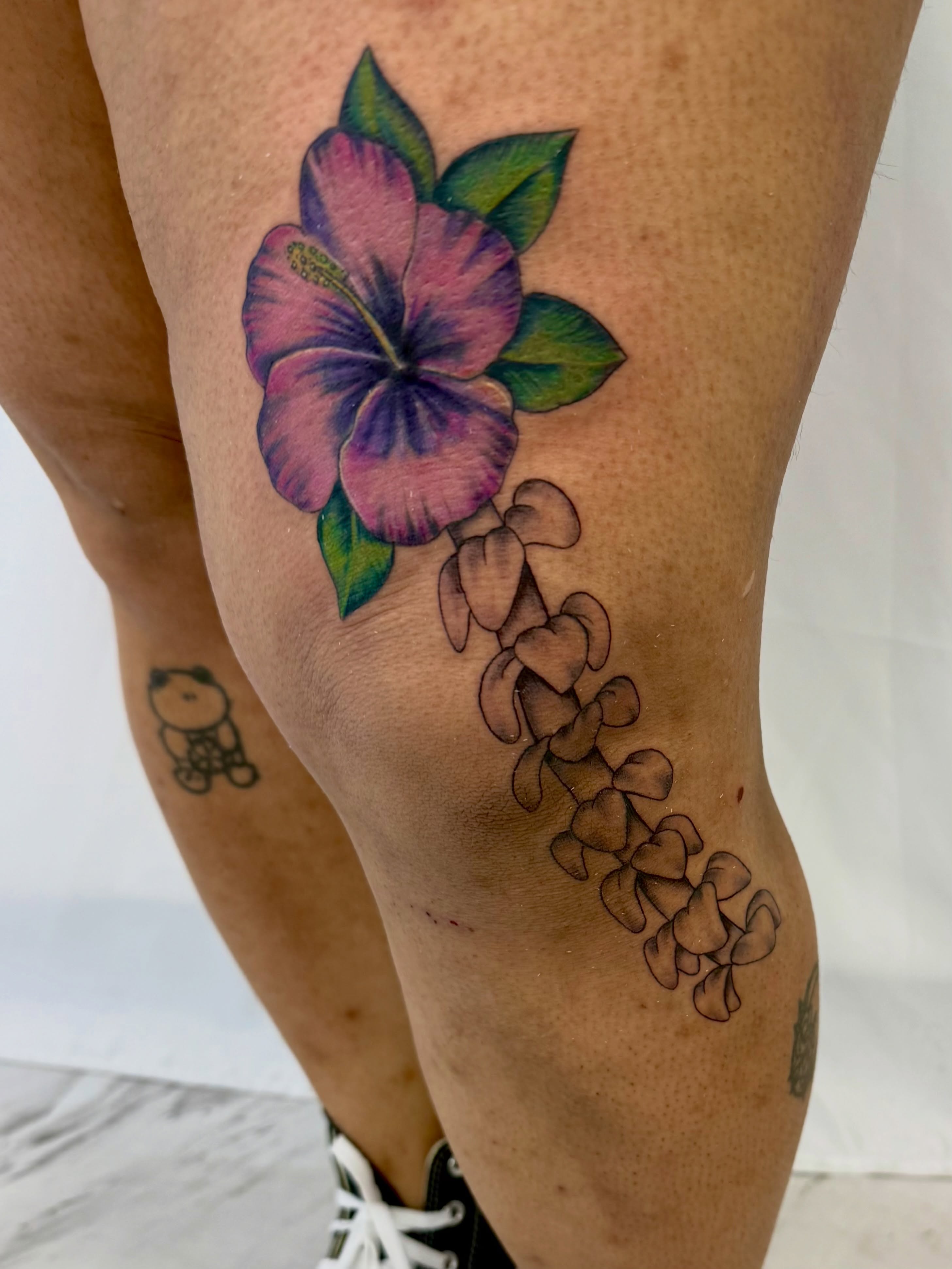 Hibiscus flower new school tattoo on the thigh by Jerry Thomas
