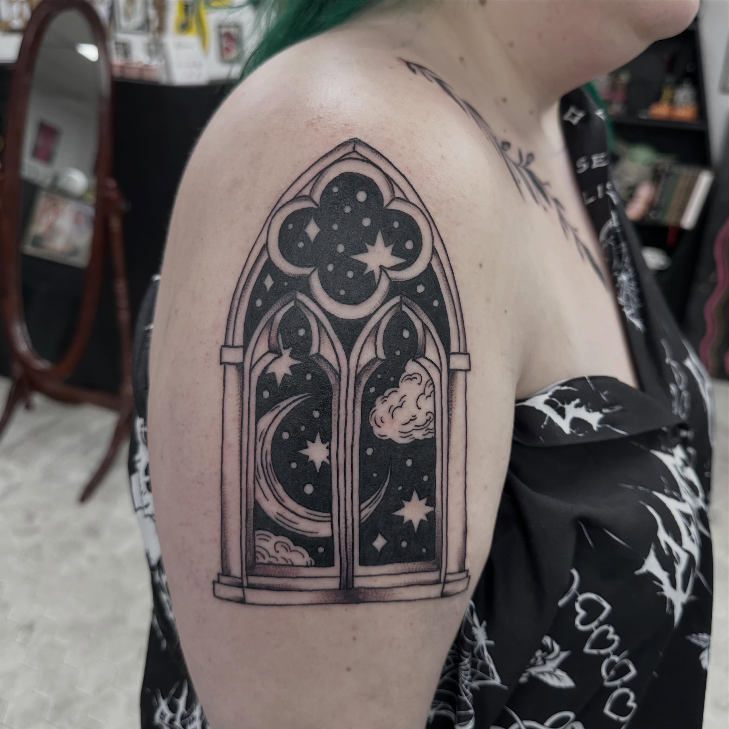 Gothic window black and grey tattoo on the shoulder by Nicki Hoverson