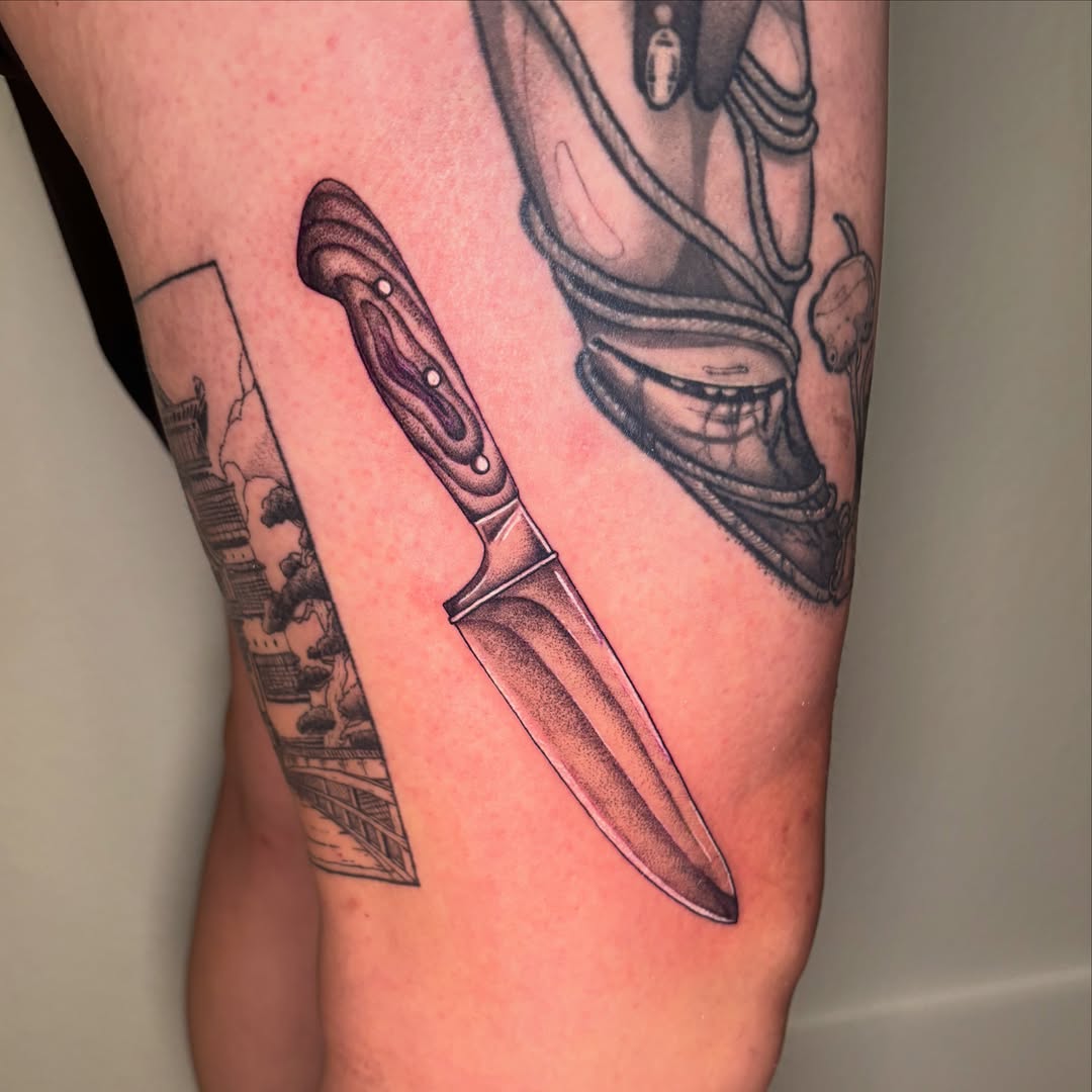 Knife black and grey tattoo on the forearm by Kiwi🌱☀️