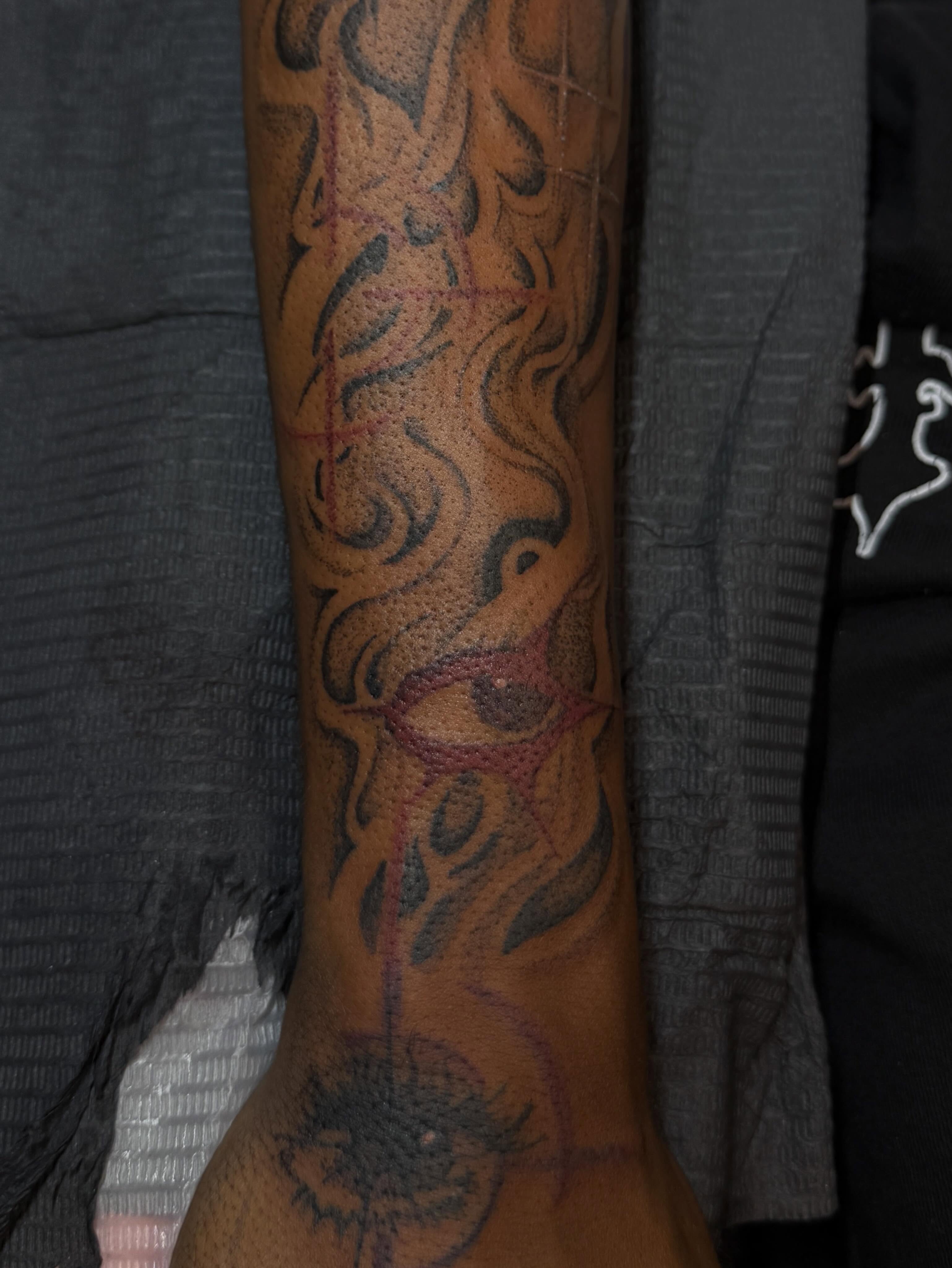 Floral design black and grey tattoo on the forearm by Destini