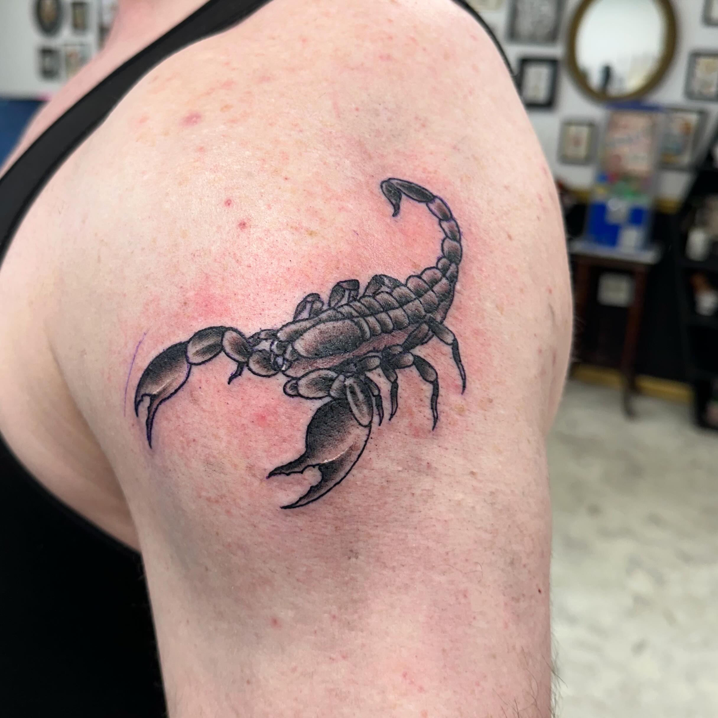 Scorpion black and grey tattoo on the shoulder by Nicki Hoverson