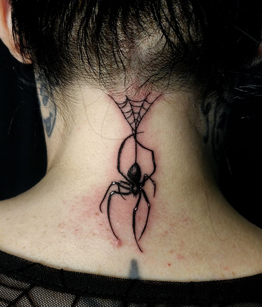 Spider black and grey tattoo on the neck by Ashly Renee