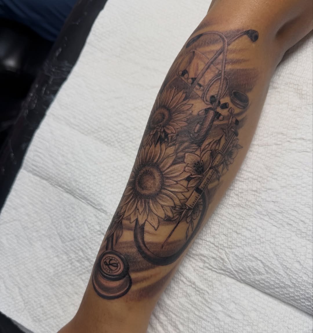 Sunflowers and musical notes realism tattoo on the forearm by Jinx Ryder