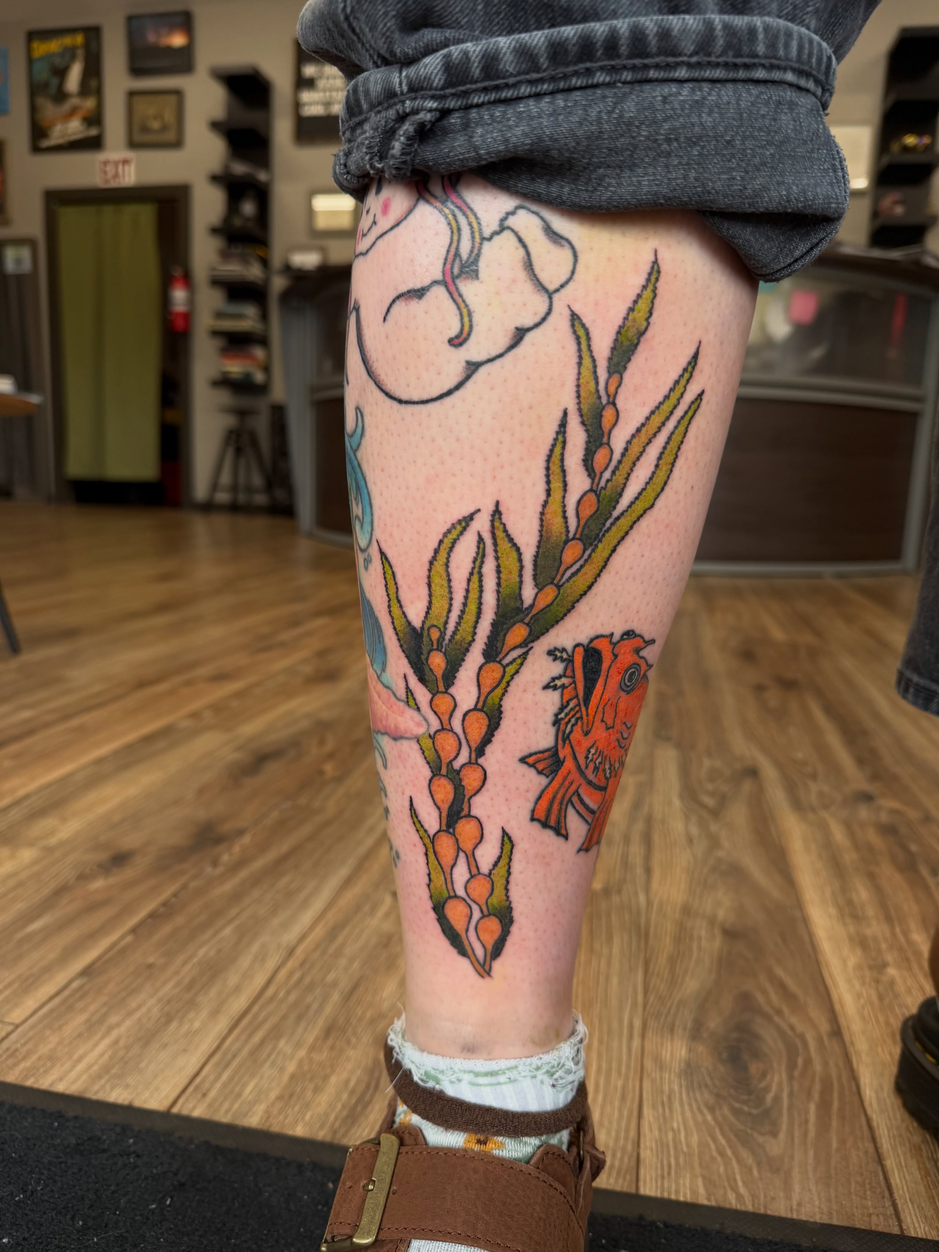 Seaweed and fish new school tattoo on the leg by Giana Masso