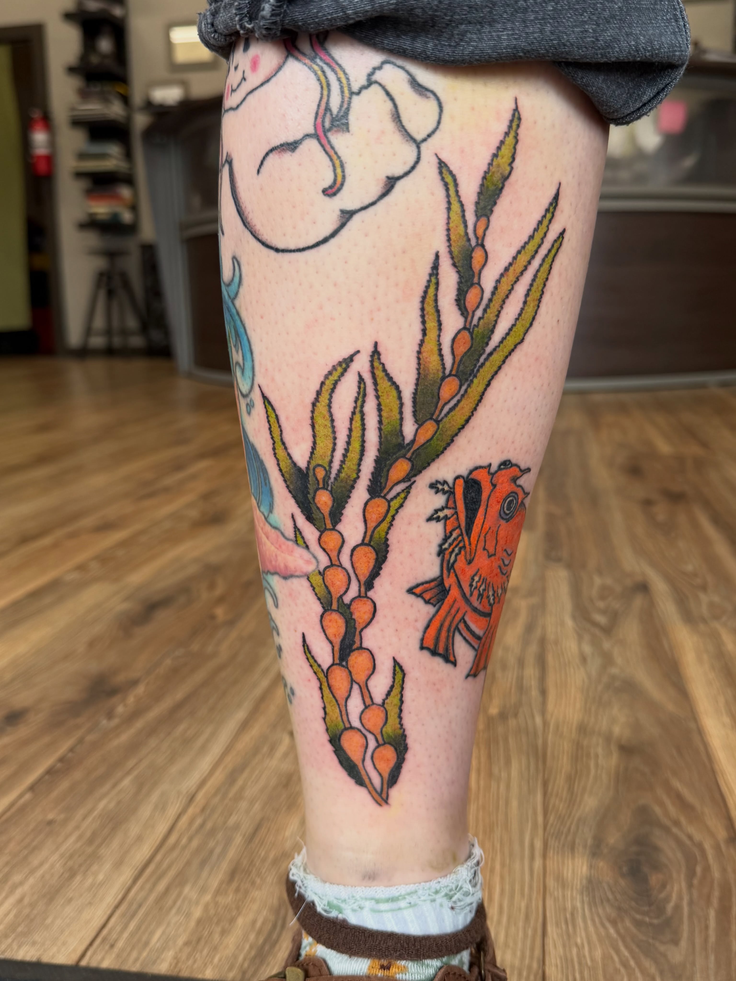 Seaweed and fish American traditional tattoo on the leg by Giana Masso