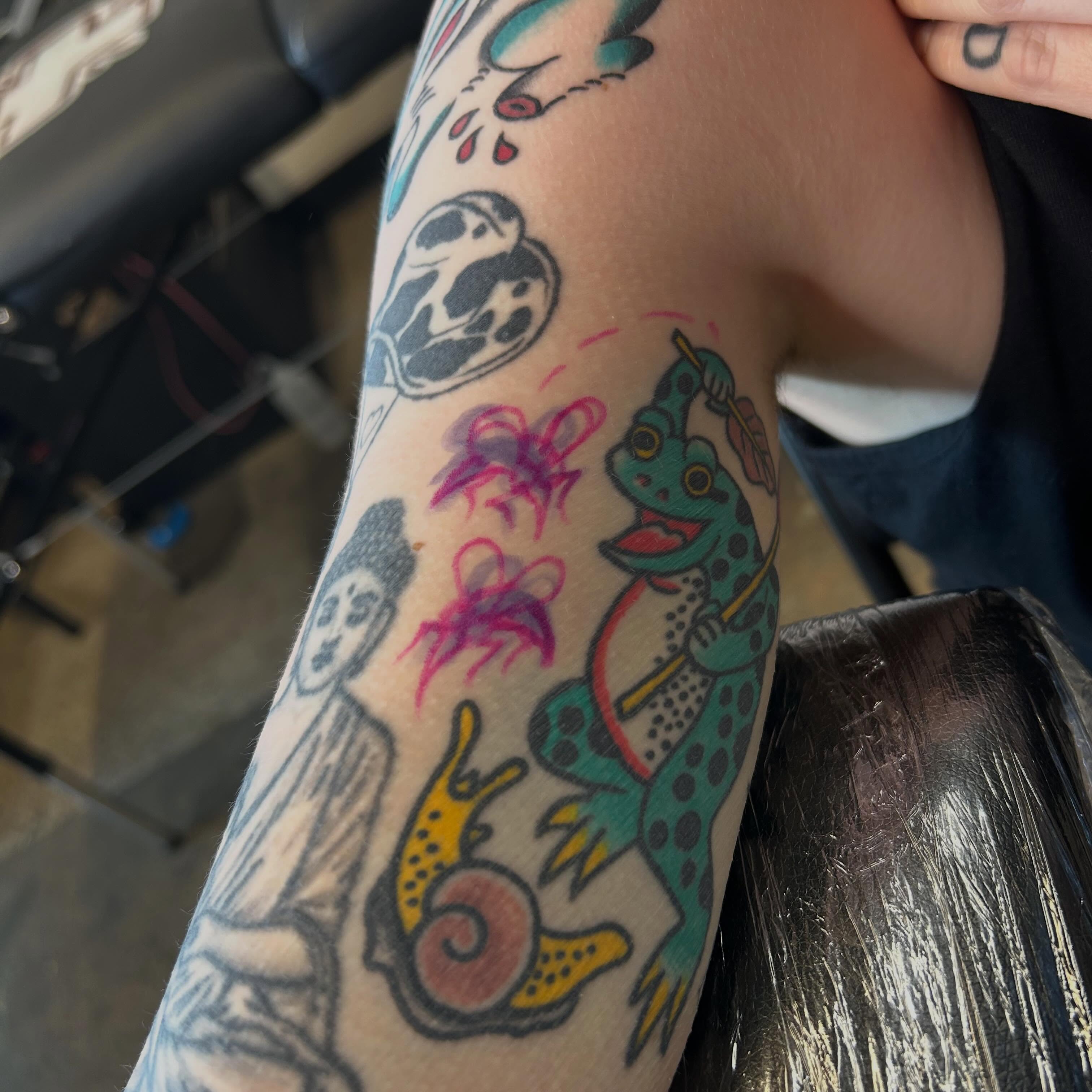 Frog and snail American traditional tattoo on the forearm by Sanjuanita