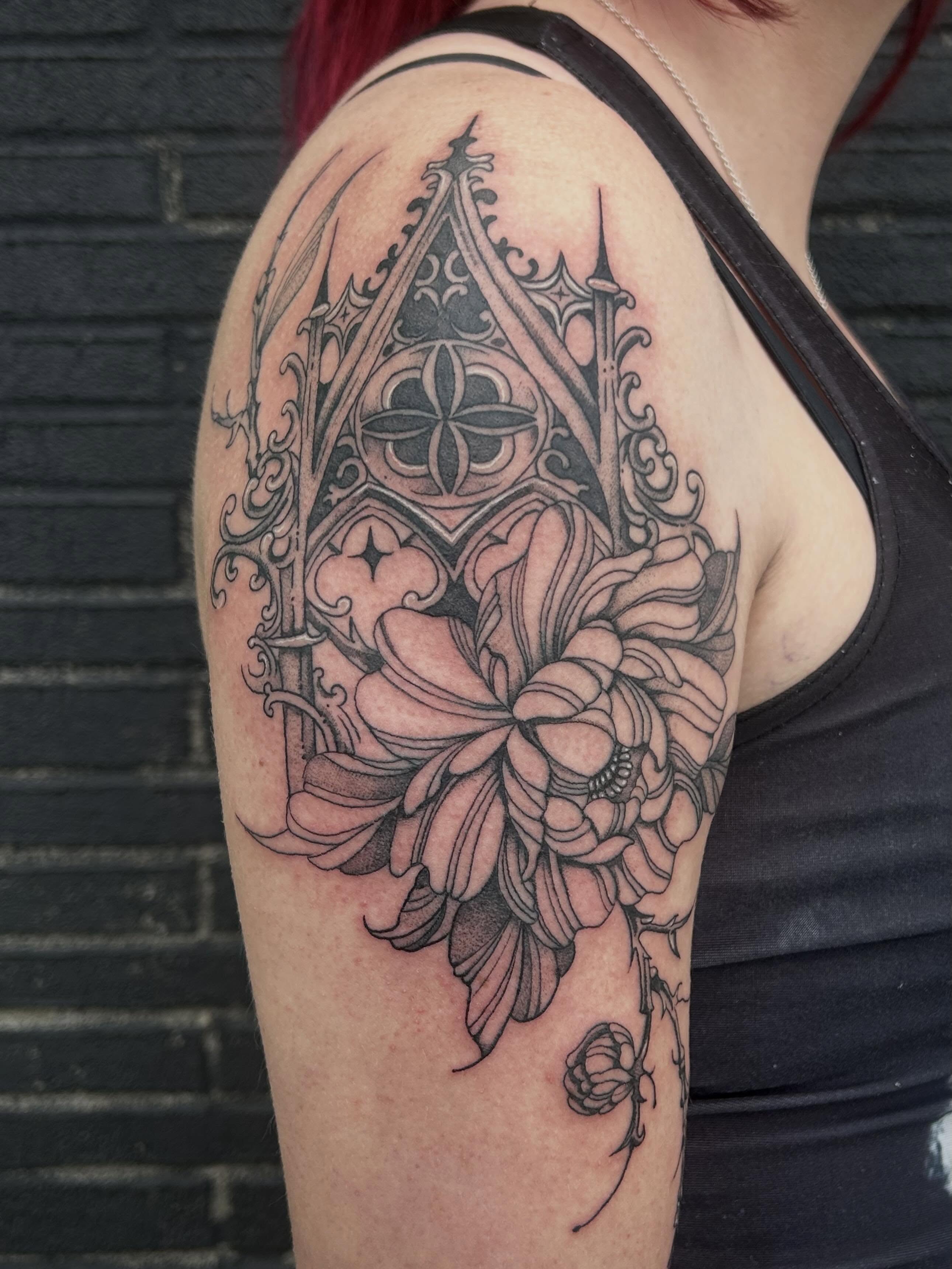 Gothic arch and flower ornamental tattoo on the shoulder by Bria🩸