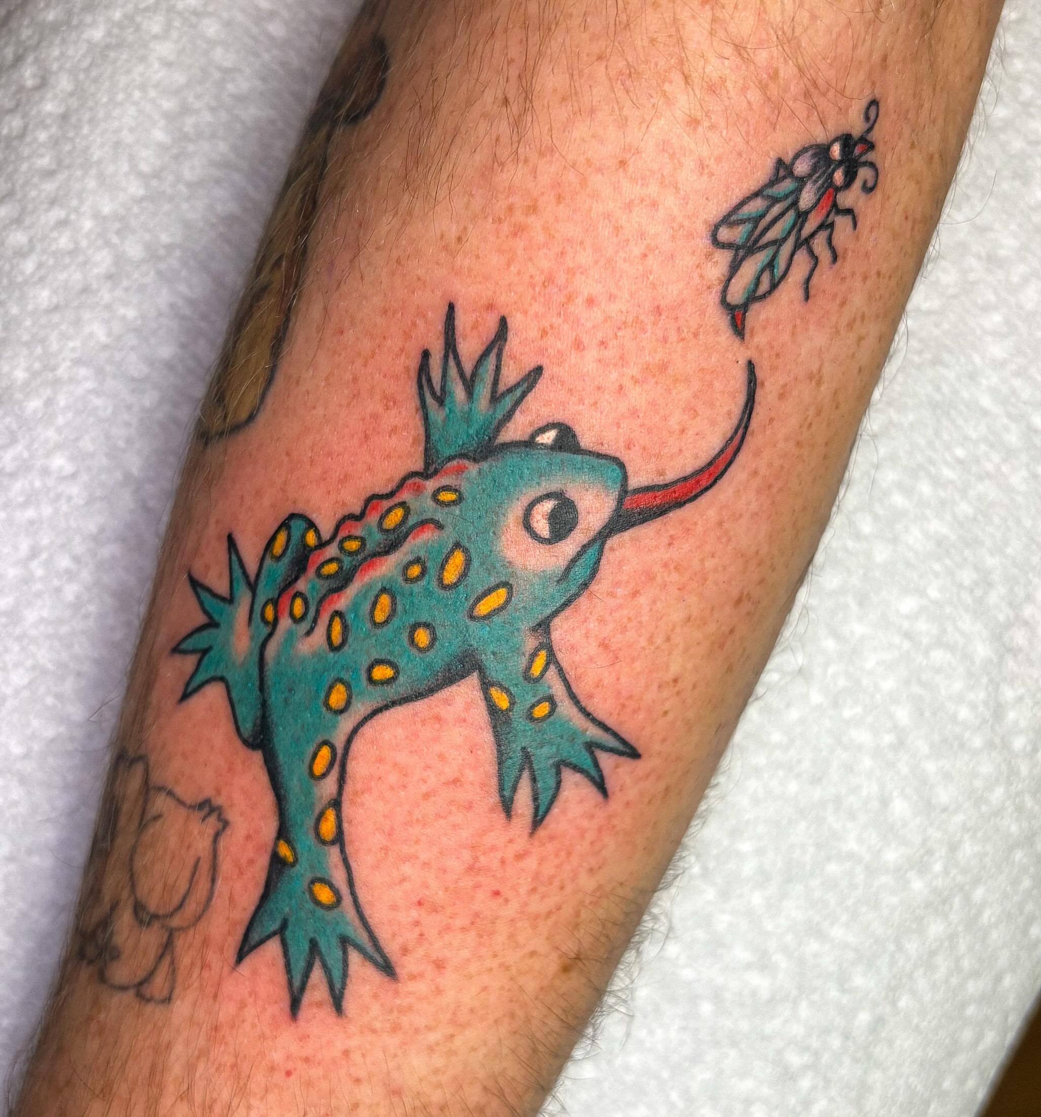 Lizard American traditional tattoo on the forearm by Katelyn Spence