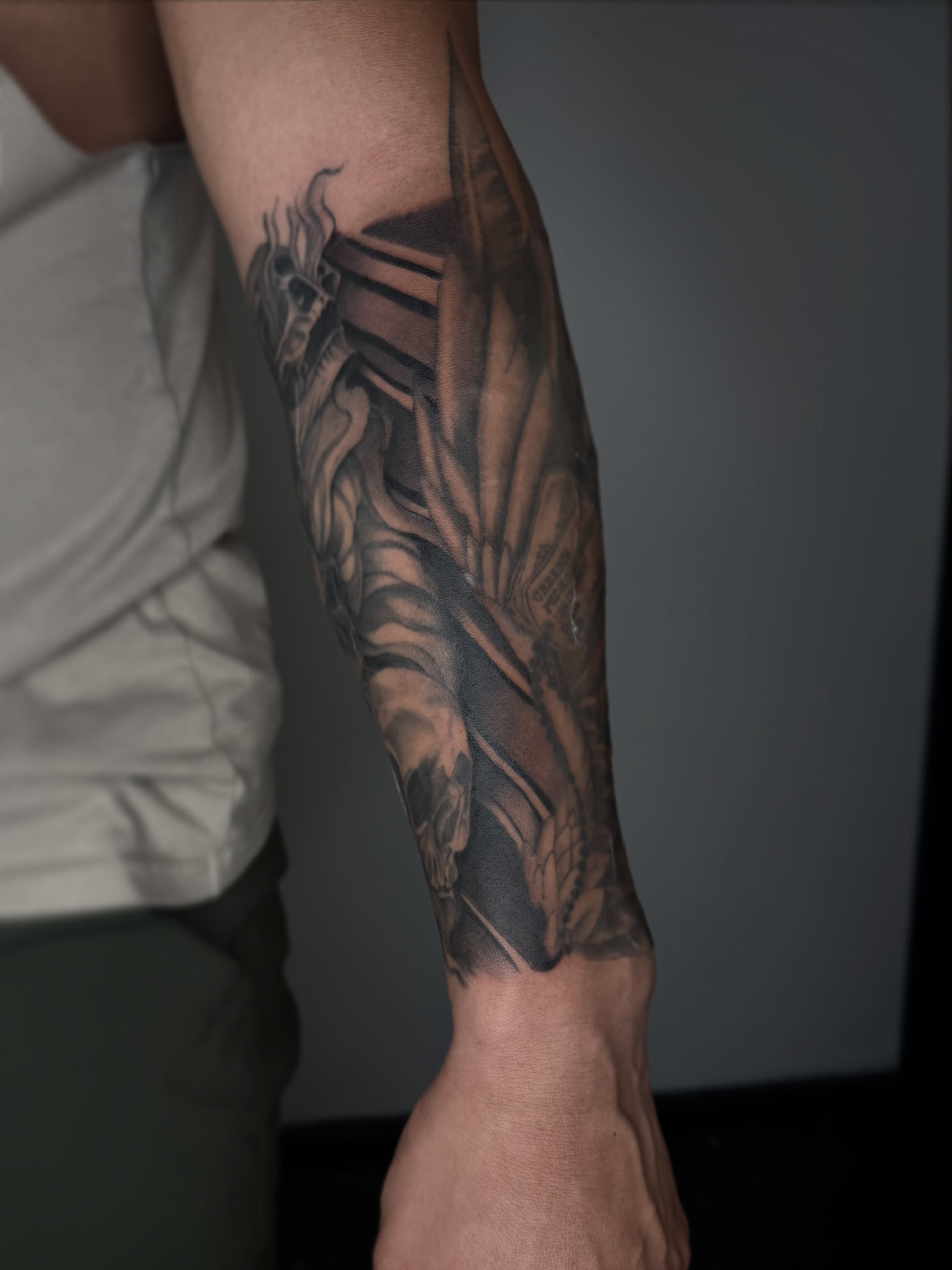 Dragon geometric tattoo on the forearm by Brandon Shelby