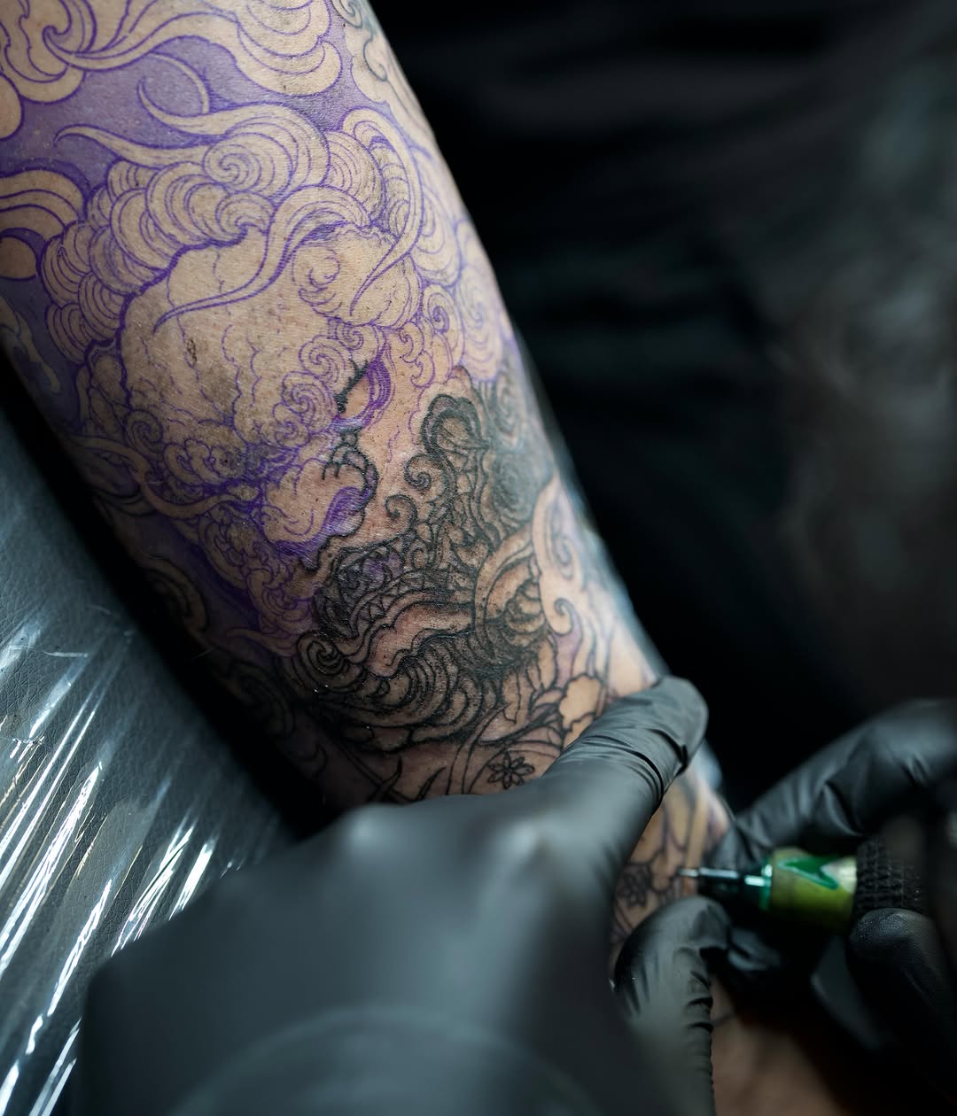 Clouds and dragon American traditional tattoo on the forearm by Kai, Charlotte, North Carolina