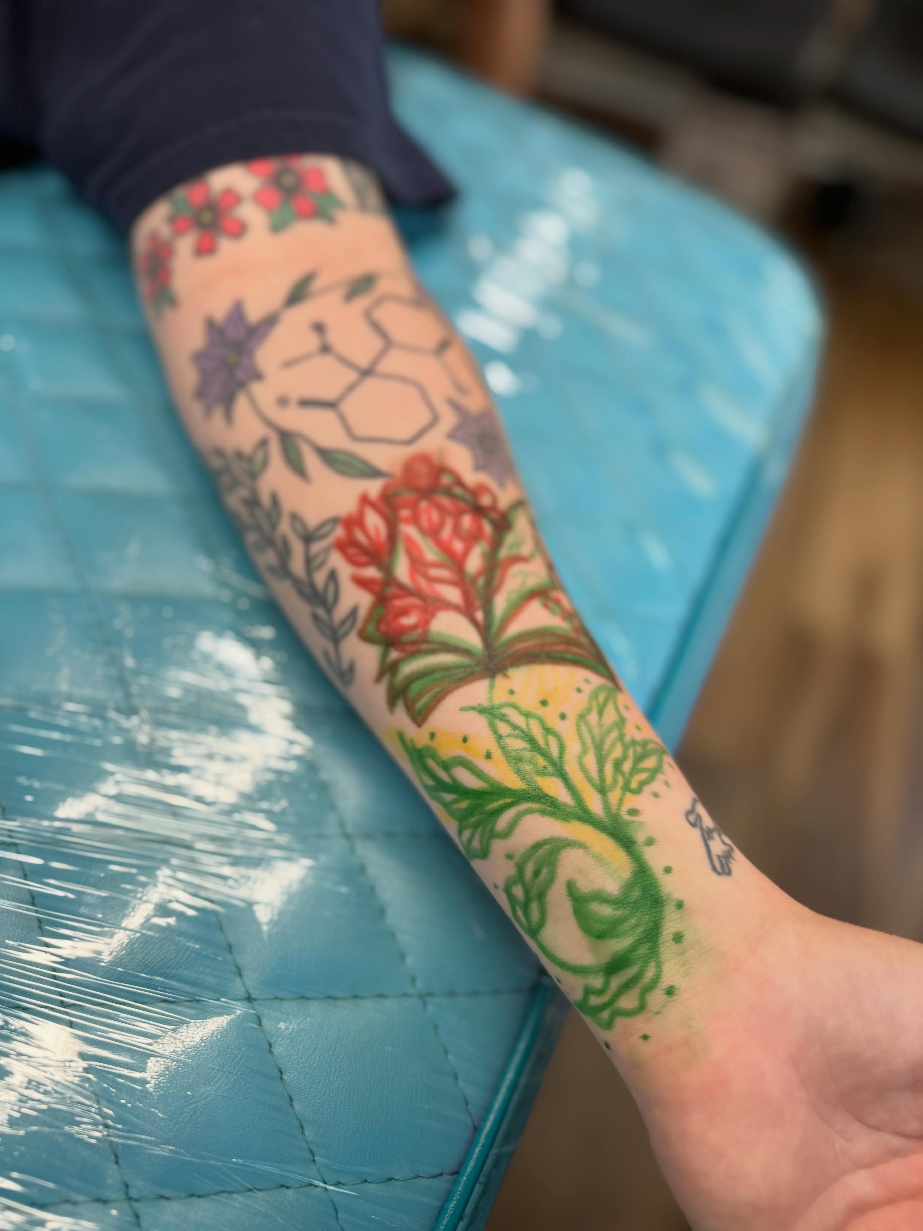 Botanical new school tattoo on the forearm by Serenity Mullins