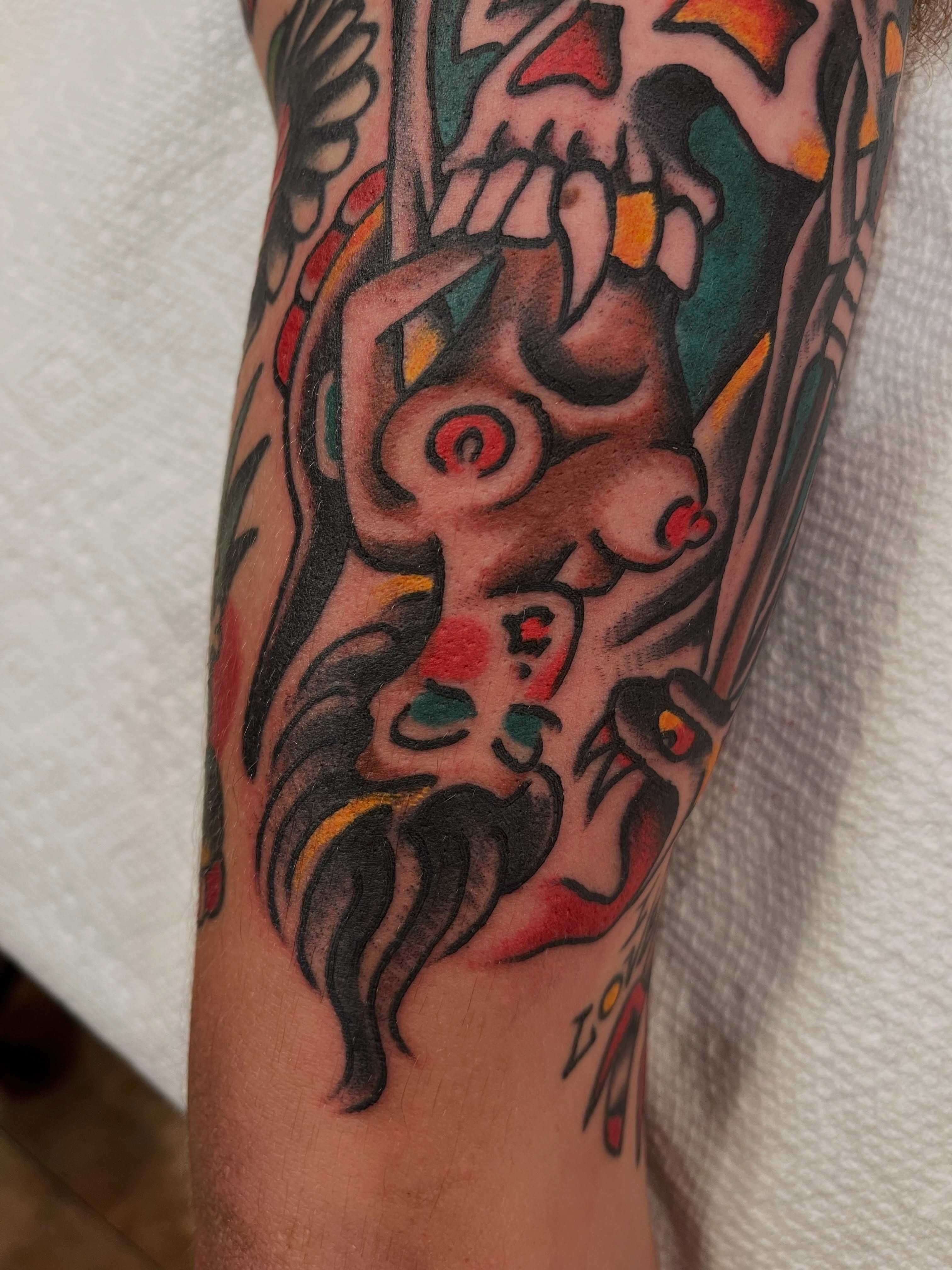 Skull and woman American traditional tattoo on the forearm by Alex Garcia - Sac City Tattoo