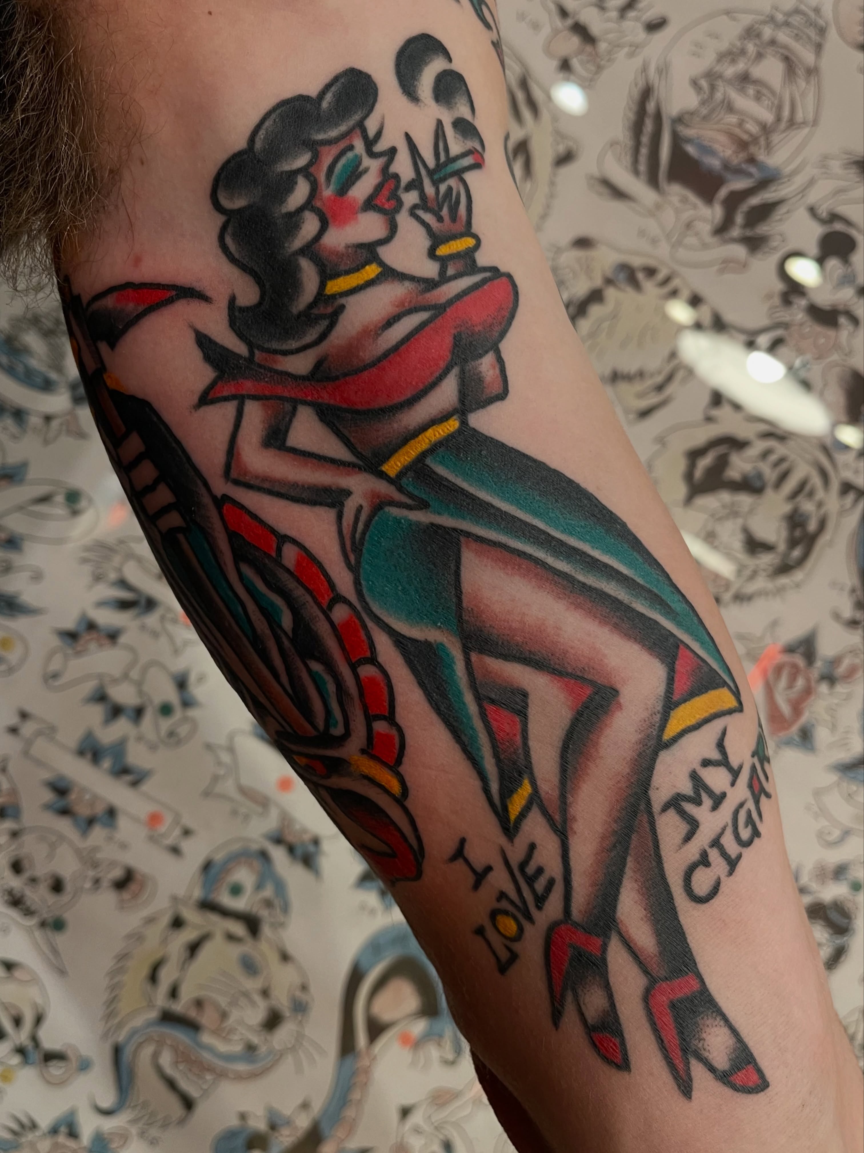 Pin-up girl American traditional tattoo on the forearm by Alex Garcia - Sac City Tattoo