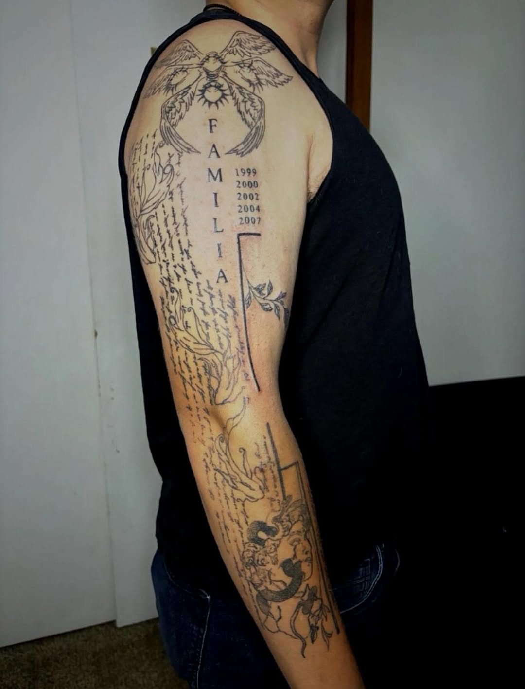 Sketch tattoo on the upper arm by sams tattoos