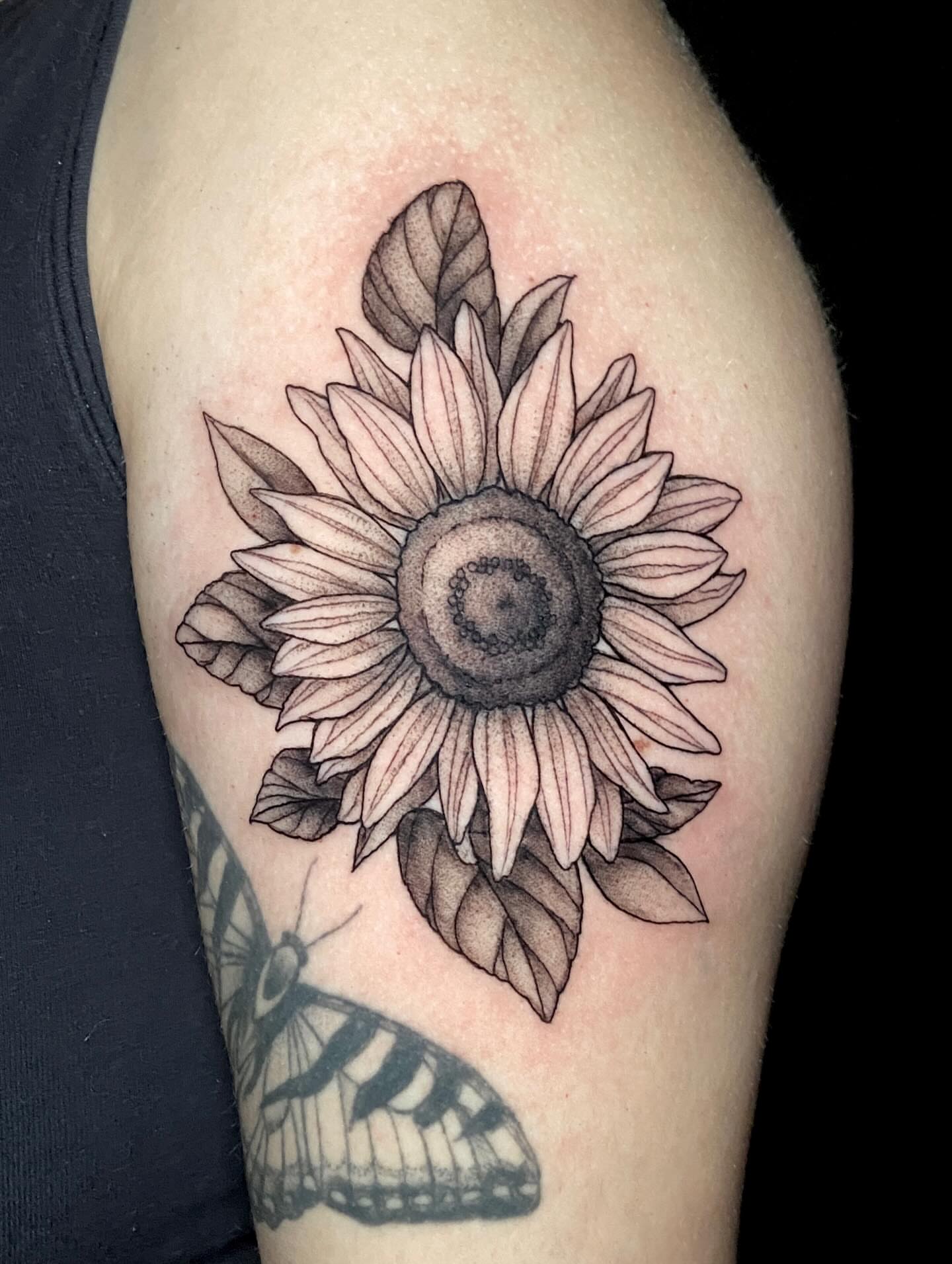 Sunflower dotwork tattoo on the thigh by Dawn Carr, Richmond, Virginia