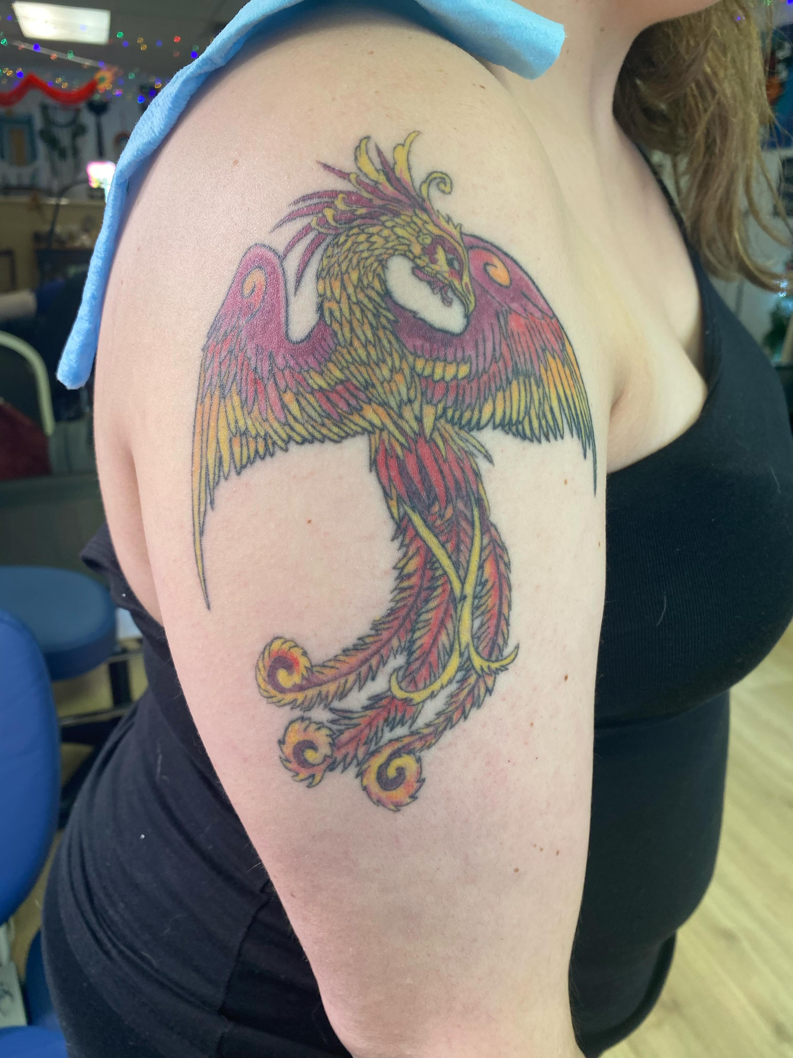 Phoenix new school tattoo on the shoulder by Katie Leeper