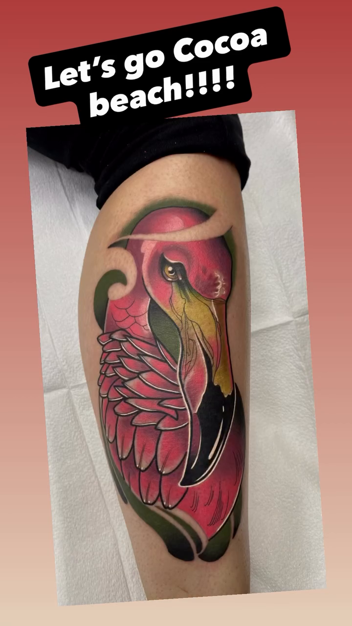 Flamingo with tropical background tattoo on the upper arm by Duff McCormack