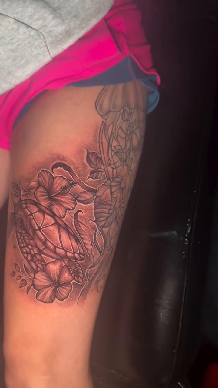 Turtle and flowers realism tattoo by Alex Wheelock