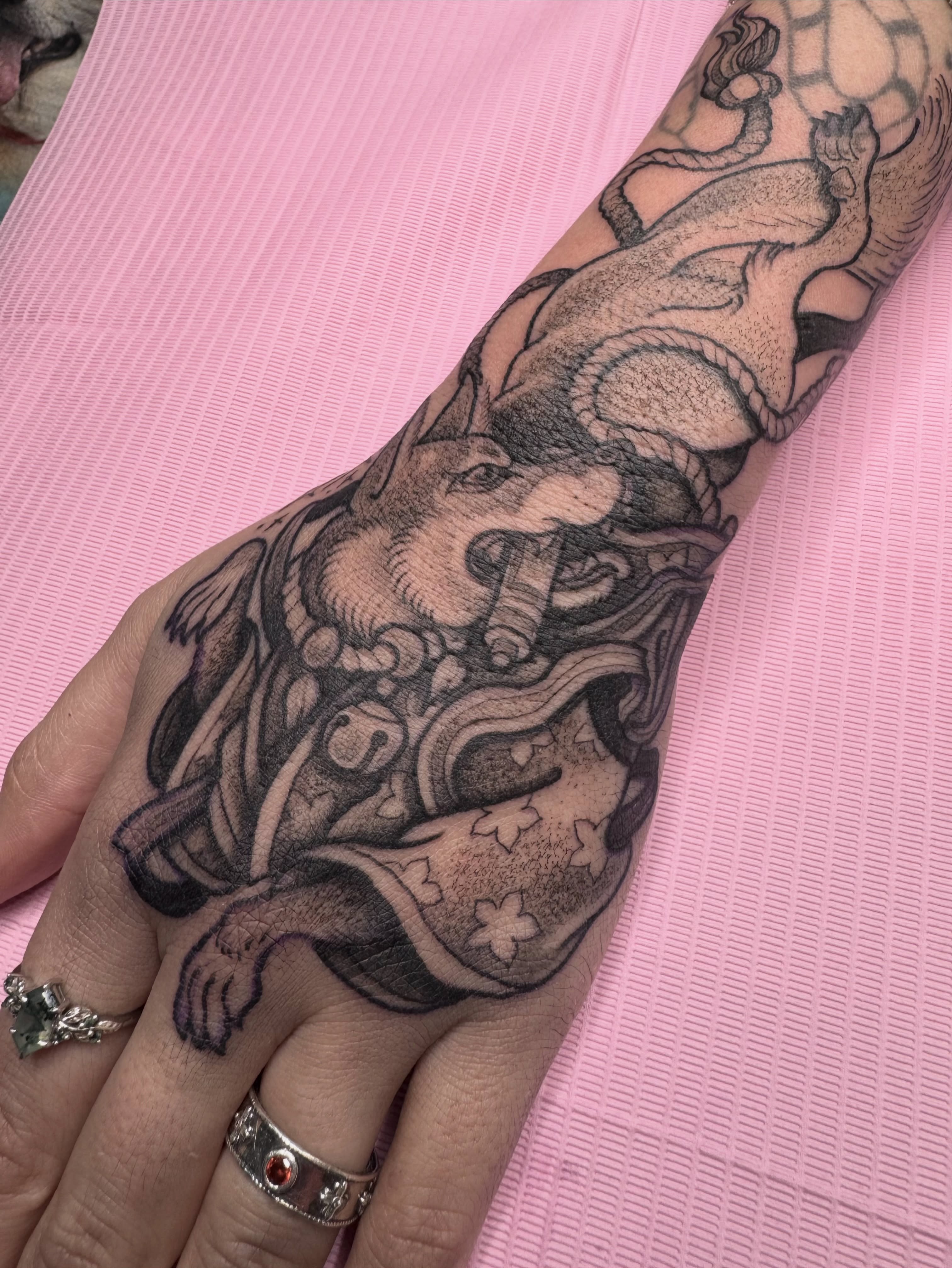 Lion black and grey tattoo on the forearm by Caleb Gesicki