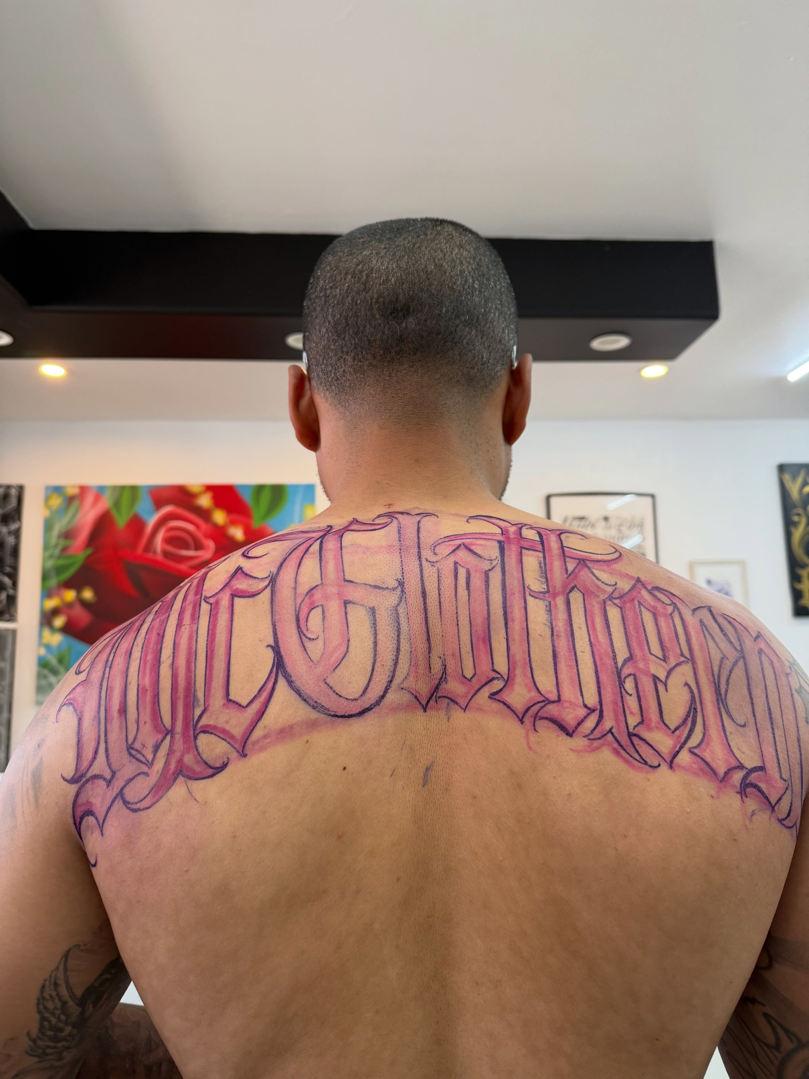 Script lettering lettering script tattoo on the back by Daniel Lopez Tattoos