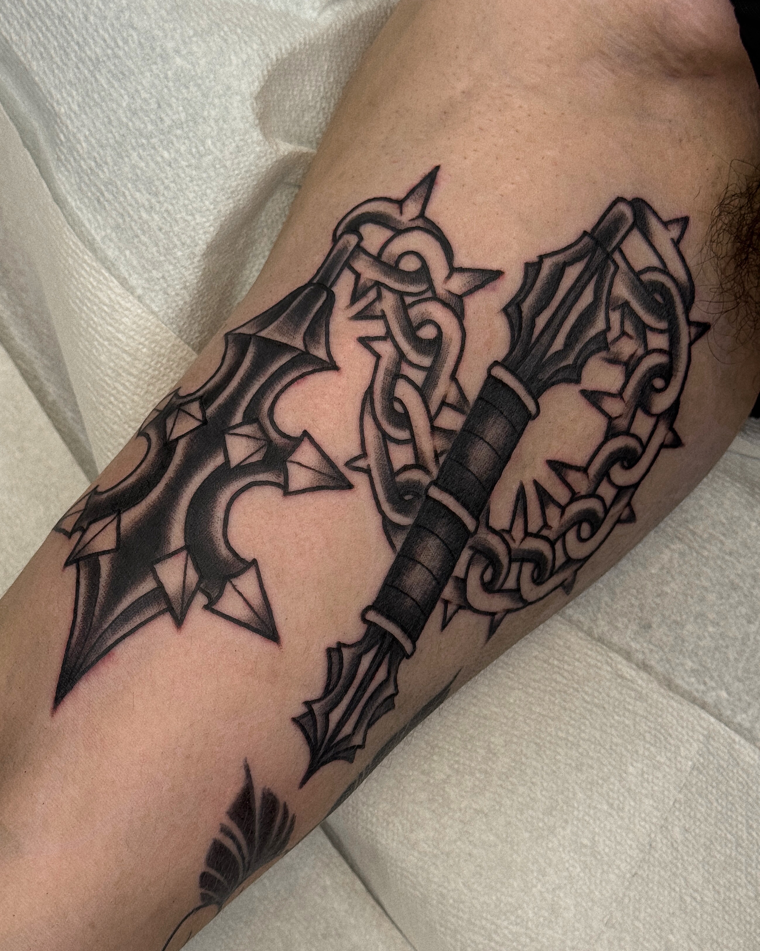Sword and dragon geometric tattoo on the forearm by Bre Grover, Vancouver, British Columbia